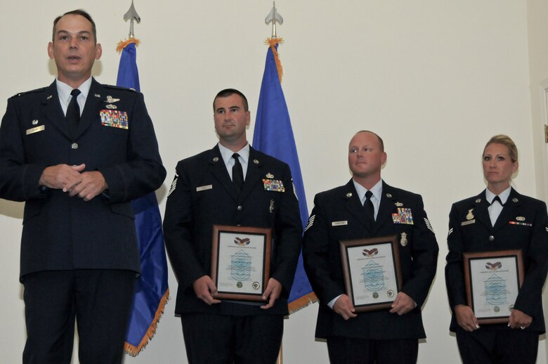 Col. Brad Richy, former commander of the 124th Fighter Wing, Idaho Air National Guard and new director of the Idaho Bureau of Homeland Security, makes closing remarks after three Airmen from the 124th Security Forces Squadron were selected as Outstanding Airmen of the Quarter for their respective category, Aug. 5 at Gowen Field.