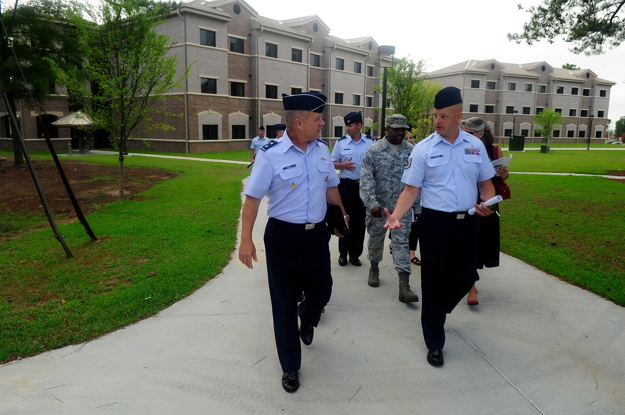 U.S. Air Force Maj. Gen. Lawrence Wells, 9th Air Force commander, speaks to Tech. Sgt. Brian Alistock, 20th Civil Engineer Squadron dorm manager, about the present and future maintenance plans for the base dormitories at Shaw Air Force Base, S.C., Aug. 6, 2012. Wells visited different squadrons on base to speak with Airmen and understand their mission and daily duties. (U.S. Air Force photo by Airman 1st Class Hunter Brady/Released)