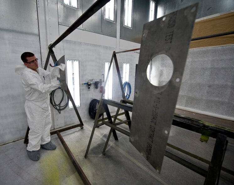 Airman 1st Class Zachary Kelly, 707th Aircraft Maintenance Squadron structural maintenance technician, cleans steel panels prior to painting them on Barksdale Air Force Base, La., Aug. 7. Reserve units such as the 707 AMXS, part of the 307th Bomb Wing located here, work in conjunction with active duty Airmen in order to leverage Air Reserve Component experience.  (U.S. Air Force photo/Staff Sgt. Chad Warren)(RELEASED)
