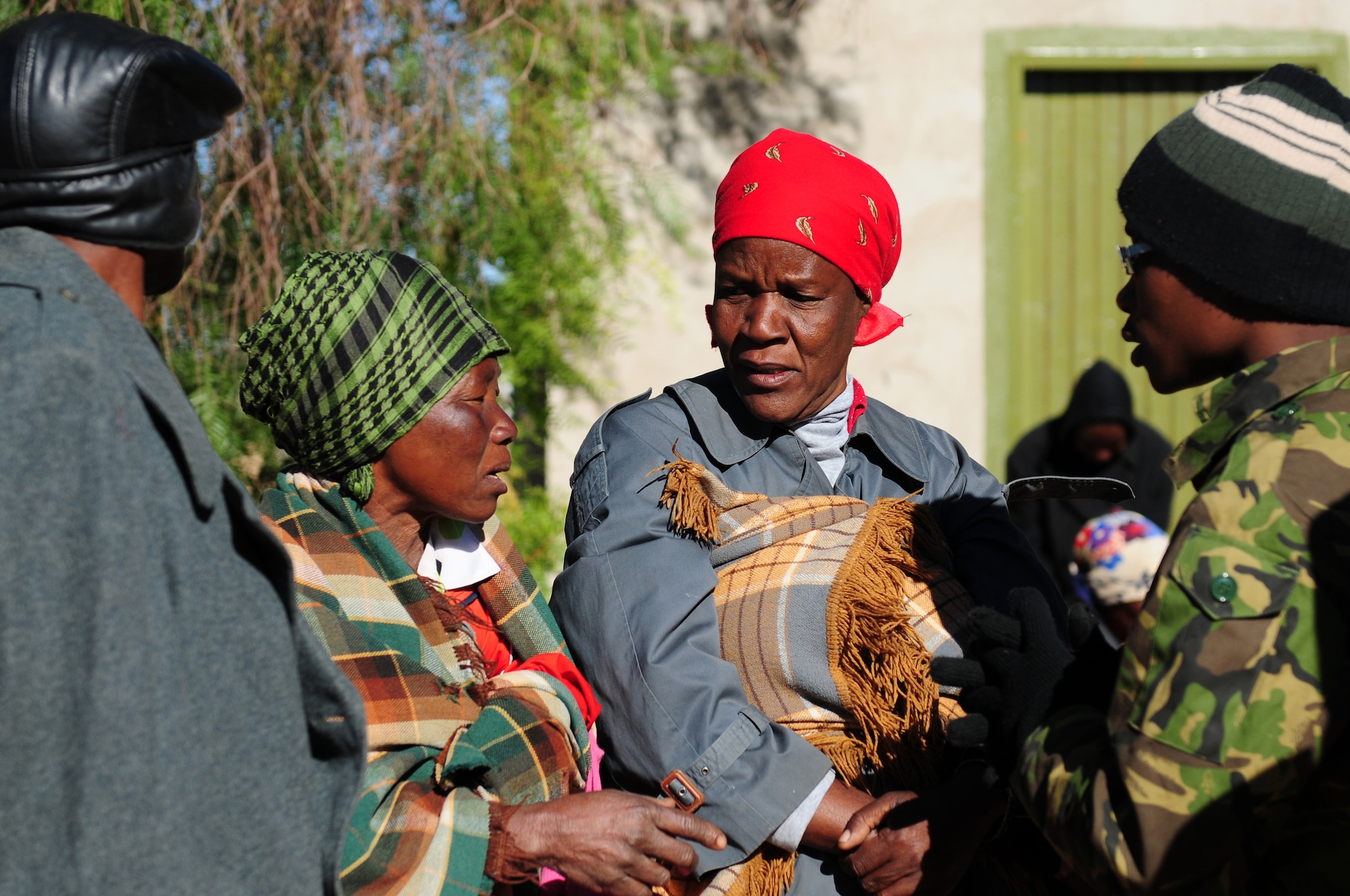 THEBEPHATSWA AIR BASE, Botswana -- Family and community members of Malwelwe village gather to receive medical treatment during a humanitarian civilian assistance Aug. 7, 2012. The HCA was provided by MEDLITE/SOUTHERN ACCORD 12, a key element in a broader series of military-to-military activities that demonstrate the strong partnership between the U.S. and BDF forces. (U.S. Air Force photo/Senior Airman Lausanne Morgan)