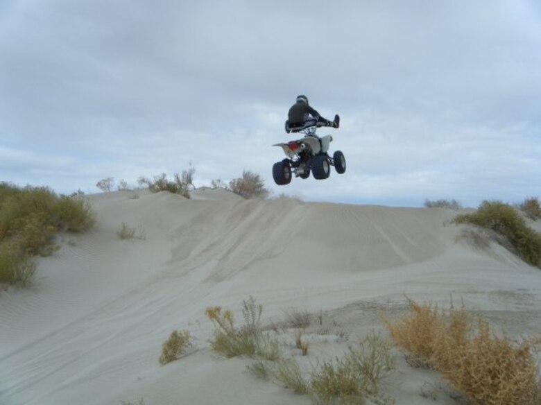 Kenneth Kowalczyk, ground safety manager at the Air Force Nuclear Weapons Center, Hill AFB, Utah, demonstrates a safe heel click at the dunes of Knolls Off-Highway Area in western Utah. Kowalczyk urges riders to use situational awareness to reduce the chance of a dune disaster. (Courtesy phto)