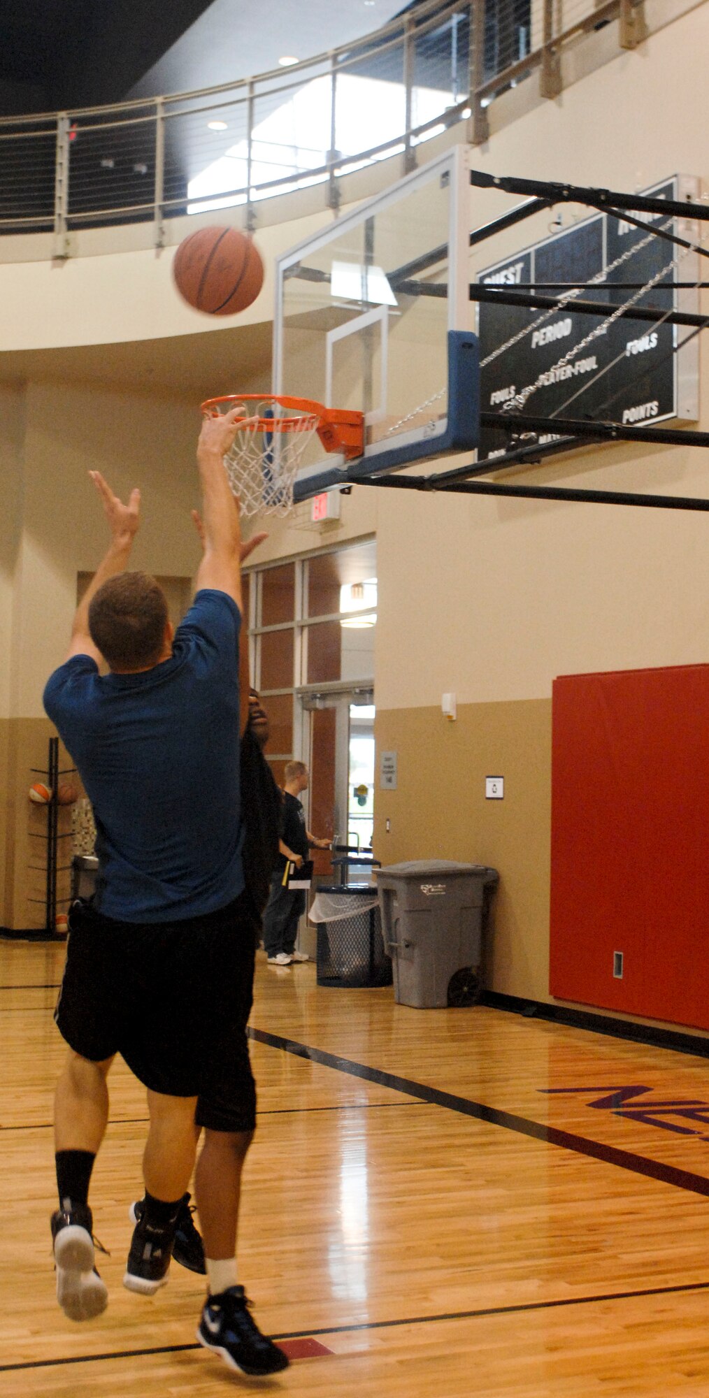 Tyler Howard shoots for a basket during a game of three on three basketball Aug. 4, 2012 at the Warrior Fitness Center on Nellis Air Force Base, Nev. The game was part of the base chapel's sports day. Sports day was designed to bring Airmen, friends and family together for sports and food.  For more information on the chapel's outreach program or upcoming events contact the base chapel at (702) 652-2950.(U.S. Air Force photo by Senior Airman Jack Sanders)
