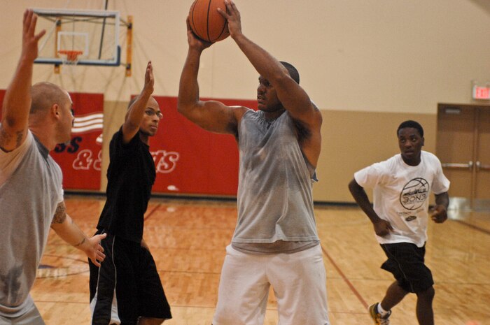 Chapel Outreach program participants play a game of three on three basketball Aug. 4, 2012 at the Warrior Fitness Center at Nellis Air Force Base, Nev. The game was part of the base chapel's sports day and was one of several games held. For more information on the chapel's outreach program or upcoming events contact the base chapel at (702) 652-2950. (U.S. Air Force photo by Senior Airman Jack Sanders)