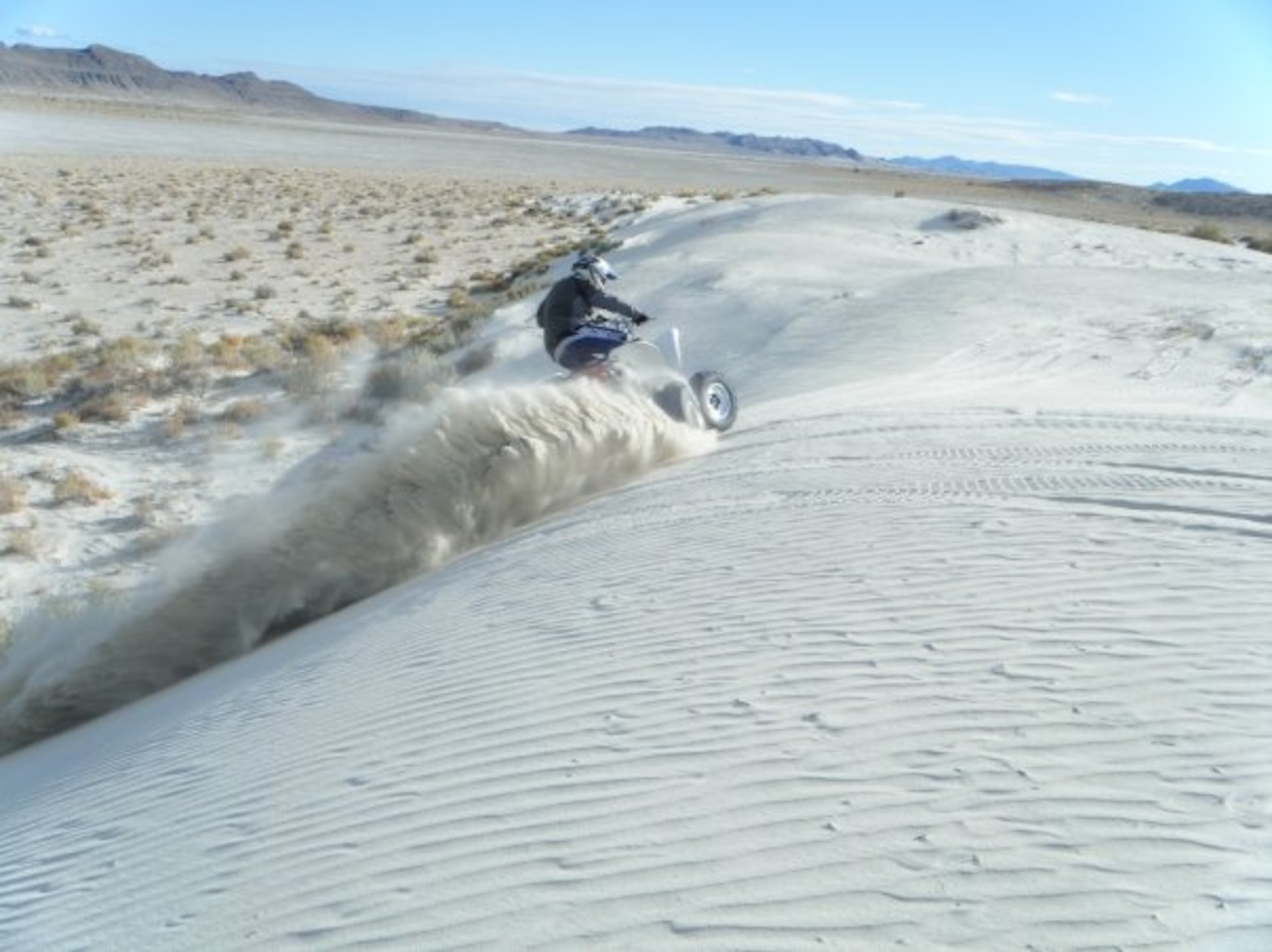 Kenneth Kowalczyk,  ground safety manager at the Air Force Nuclear Weapons Center, Hill AFB, Utah, navigates a dune for a safe ridge slide at Knolls Off-Highway Area in western Utah. Wearing proper protective gear, being familiar with the characteristics of the area, as well as other riders in the vicinity, increase riders' chances of a safe adventure. (Courtesy photo)