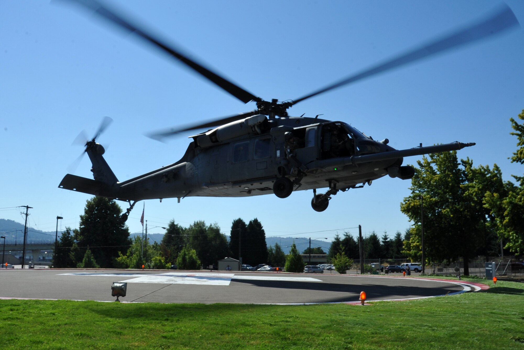 An HH-60 Pave Hawk helicopters from the 305th Rescue Squadron lands at the Randall Children's Hospital at Legacy Emmanuel in Portland, Ore. The heliocopter off-loaded pararescuemen from the 304th Rescue Squadron as they delivered toy's via "Operation Toy Drop". (U.S. AIr Force Photo/ Master Sgt. Luke Johnson) 