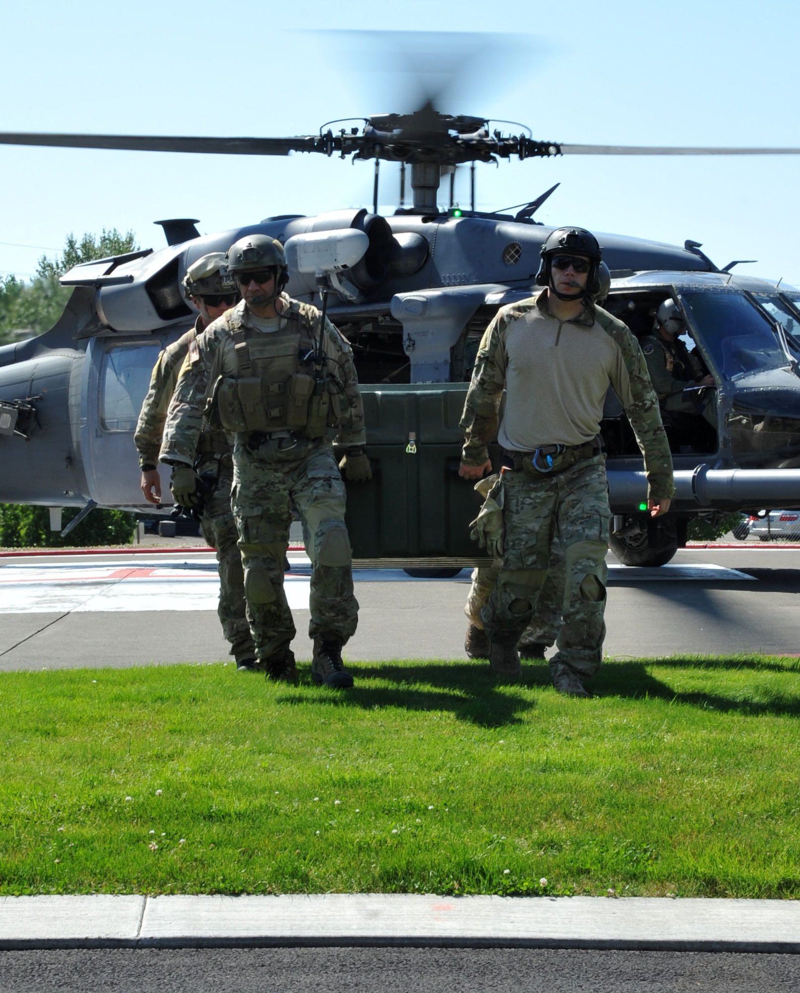 Pararescuemen from the 304th Rescue Squadron off load toys at The Randall Children's Hospital at Legacy Emmanuel in Portland, Ore.  The PJ's arrived both by air, via HH-60 Pave Hawk helicopters from the 305th Rescue Squadron, and from the ground on Humvee's as they delivered toy's room to room in the children's hospital. (U.S. Air Force Photo/ Master Sgt, Luke Johnson)