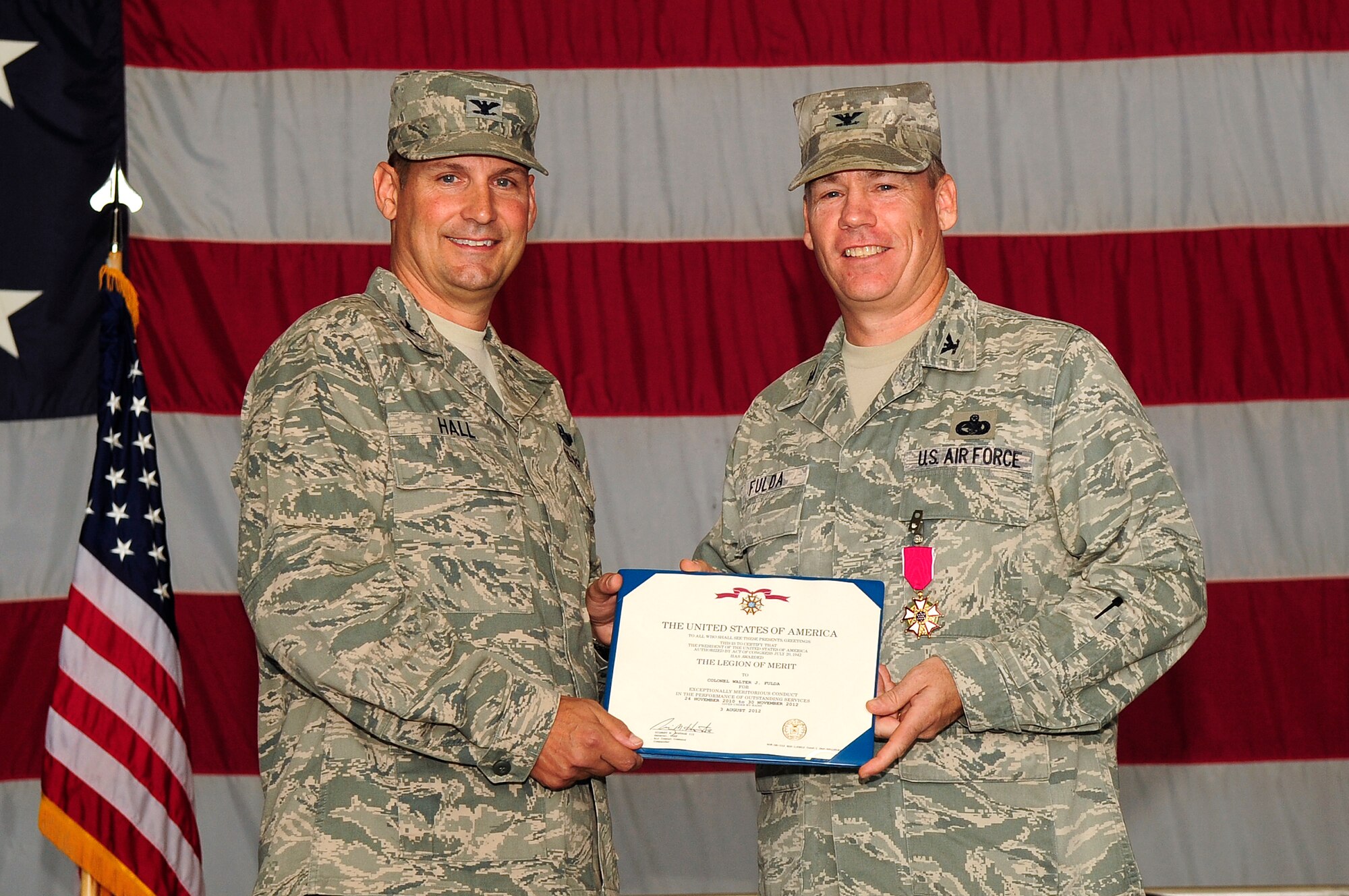 U.S. Air Force Col. Clay Hall, 20th Fighter Wing commander, presents Col. Walter Fulda, 20th Mission Support Group commander, with the Legion of Merit at Shaw Air Force Base, S.C., Aug. 7, 2012. Fulda has been the commander of the MSG for 22 months. (U.S. Air Force photo by Airman 1st Class Hunter Brady/Released)