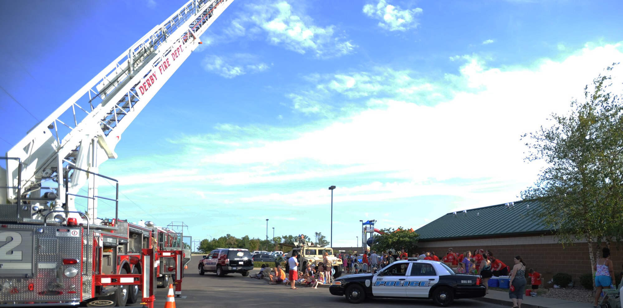 Team McConnell and local law enforcement agencies participate in the National Night Out event at Rock River Rapids August 6, 2012, Derby, Kan. This was the 29th annual NNO event to raise awareness in the community about crime and drug prevention. (U.S. Air Force photo/Airman 1st Class Victor J. Caputo)