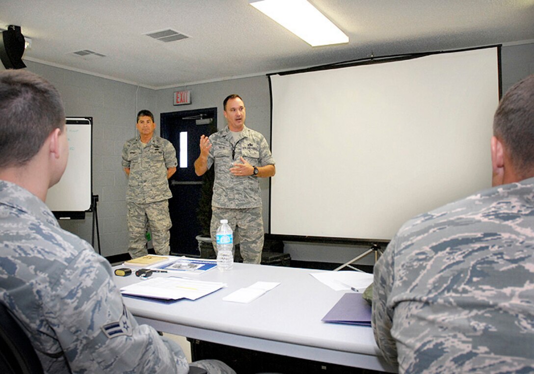 Brigadier General Michael Hepner, 138th Fighter Wing Commander, and 138th Fighter Wing Command Chief Master Sergeant Thomas Payne, speak with students at the 138th FW Joint Terminal Attack Controller (JTAC) course, located at Camp Gruber, Oklahoma Army National Guard Training Facility.  The school provides Air National Guard tactical air control party (TACP) students with the highest quality career field education and training in order to standardize and expedite the overall JTAC training pipeline. Students who complete the 8 week intensive program are expected to return to their home units ready for a combat mission ready TACP checkout.  Training covers communications, shooting, small unit tactics, off road driving, equipment, navigation, and close air support basics.  The training program was recently relocated from Ft. Sill Army post to the Army National Guard Training Facility located in Braggs, Oklahoma.  (National Guard photo by Master Sergeant Preston Chasteen/Released)