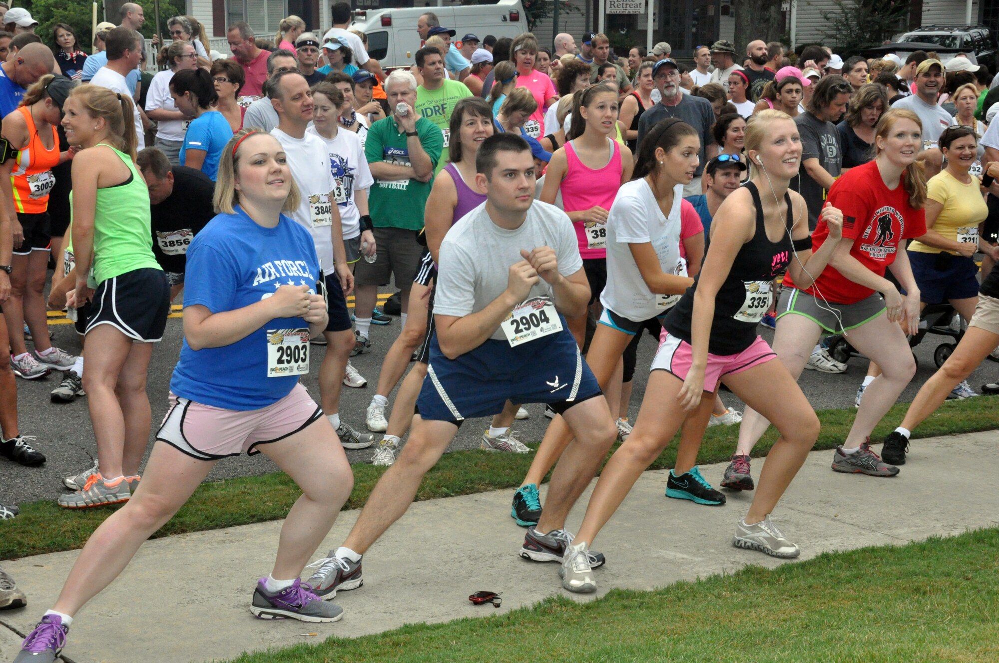Senior Airman Joseph Moore, a dental assistant from Hurlburt Field, Fla., stretches before a 5k held in support of the Wounded Warrior Project on Aug 4 in Kennesaw, Ga. Moore was in Kennesaw visiting family. (U.S. Air Force photo/Senior Airman Christina Bozeman)