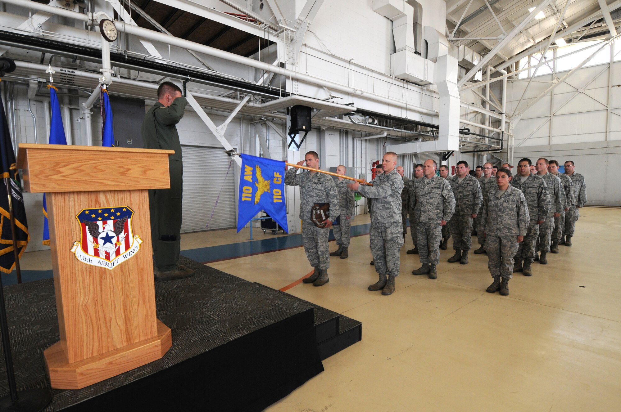 110th Airlift Wing Commander, Col. Ronald Wilson calls a Wing Commanders Call on Saturday, August 4, 2012 at the Battle Creek Air National Guard Base, Mich. The 110th Airlift Wing Communications Flight received the 2011 Air Force Outstanding Unit Award, Tech. Sgt. Destiny Taylor, 110th Airlift Wing Comptroller Flight received the lifesaving award, 110th Airlift Wing Safety Office received the William W. Spruance Safety Award, Senior Airmen Trenton Broughton (217th Air Operations Group) received the State of Michigan's Airmen of the Year for 2012, Tech. Sgt. Joseph Rodriguez (110th Airlift Wing Civil Engineering Squadron) received the State of Michigan's Honor Guard Member of the Year for 2012, and Senior Master Sgt. Donald Cassada (110th Airlift Wing Maintenance Group) received the State of Michigan's Senior Noncommissioned Officer of the Year for 2012.  Col. Wilson also took time to discuss new and existing mission updates. (U.S. Air National Guard Photo by Master Sgt. Sonia Pawloski/Released)