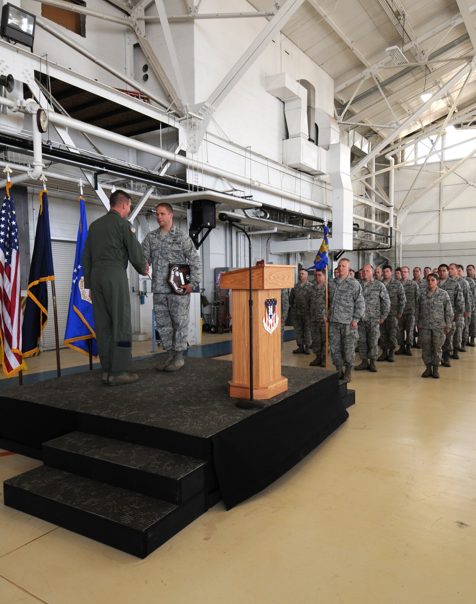 110th Airlift Wing Commander, Col. Ronald Wilson calls a Wing Commanders Call on Saturday, August 4, 2012 at the Battle Creek Air National Guard Base, Mich. The 110th Airlift Wing Communications Flight received the 2011 Air Force Outstanding Unit Award, Tech. Sgt. Destiny Taylor, 110th Airlift Wing Comptroller Flight received the lifesaving award, 110th Airlift Wing Safety Office received the William W. Spruance Safety Award, Senior Airmen Trenton Broughton (217th Air Operations Group) received the State of Michigan's Airmen of the Year for 2012, Tech. Sgt. Joseph Rodriguez (110th Airlift Wing Civil Engineering Squadron) received the State of Michigan's Honor Guard Member of the Year for 2012, and Senior Master Sgt. Donald Cassada (110th Airlift Wing Maintenance Group) received the State of Michigan's Senior Noncommissioned Officer of the Year for 2012.  Col. Wilson also took time to discuss new and existing mission updates. (U.S. Air National Guard Photo by Master Sgt. Sonia Pawloski/Released)