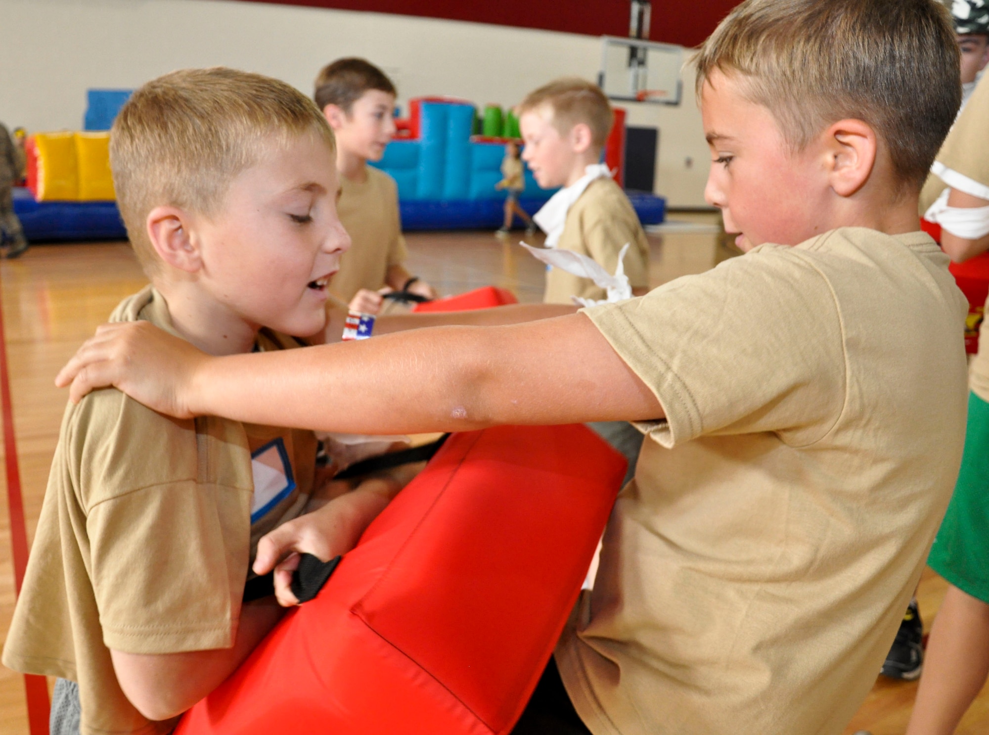 BUCKLEY AIR FORCE BASE, Colo. -- Two children practice hand-to-hand combatives during the Basic Military Training portion of Operation Future Forces Aug. 4, 2012.  The event focused on providing the children with an opportunity to experience a simulated deployment.  (U.S. Air Force photo by Staff Sgt. Nicholas Rau)