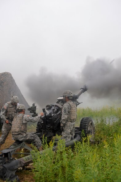 U.S. Army soldiers from the 10th Mountain Division, 3rd Battalion, 6th Field Artillery, Alpha Battery Company, 2nd Platoon, fires an M119 Howitzer at Fort Drum, N.Y., July 26, 2012.The M119 can be moved quickly and employed to provide maximum fire power without requiring a recoil pit. (U.S. Air Force photo by Airman 1st Class Douglas Ellis/Released)

