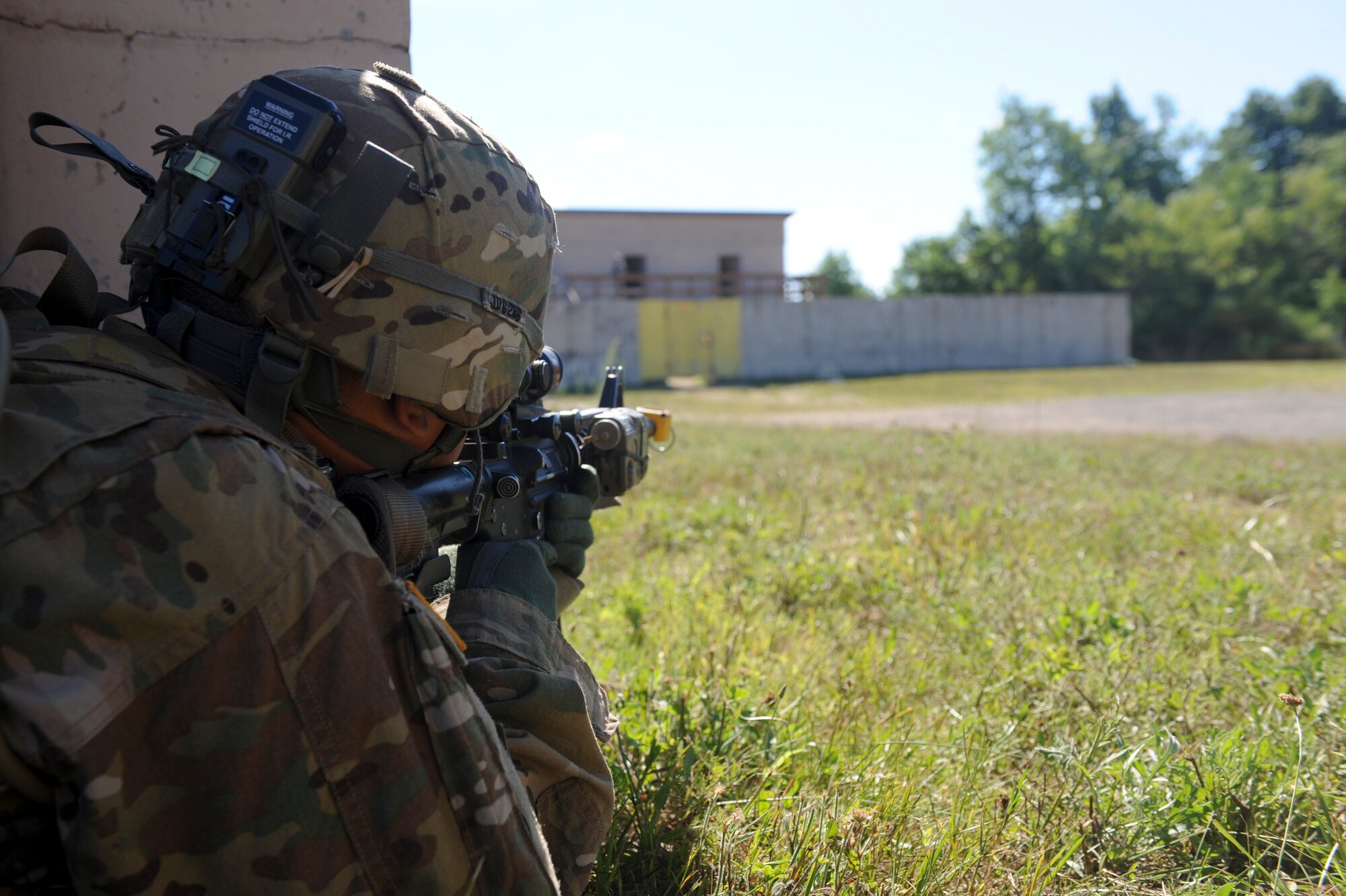 U.S. Army Sgt. Jason Diaz, 10th Mountain Division, 4-31 Infantry Battalion, Bravo Company, 2nd Platoon, takes aim during a training scenario at Fort Drum, N.Y., July 25, 2012. Diaz ensured the area was clear of hostile forces before moving forward. (U.S. Air Force photo by Airman 1st Class Douglas Ellis/Released)
