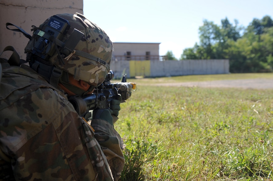 U.S. Army Sgt. Jason Diaz, 10th Mountain Division, 4-31 Infantry Battalion, Bravo Company, 2nd Platoon, takes aim during a training scenario at Fort Drum, N.Y., July 25, 2012. Diaz ensured the area was clear of hostile forces before moving forward. (U.S. Air Force photo by Airman 1st Class Douglas Ellis/Released)
