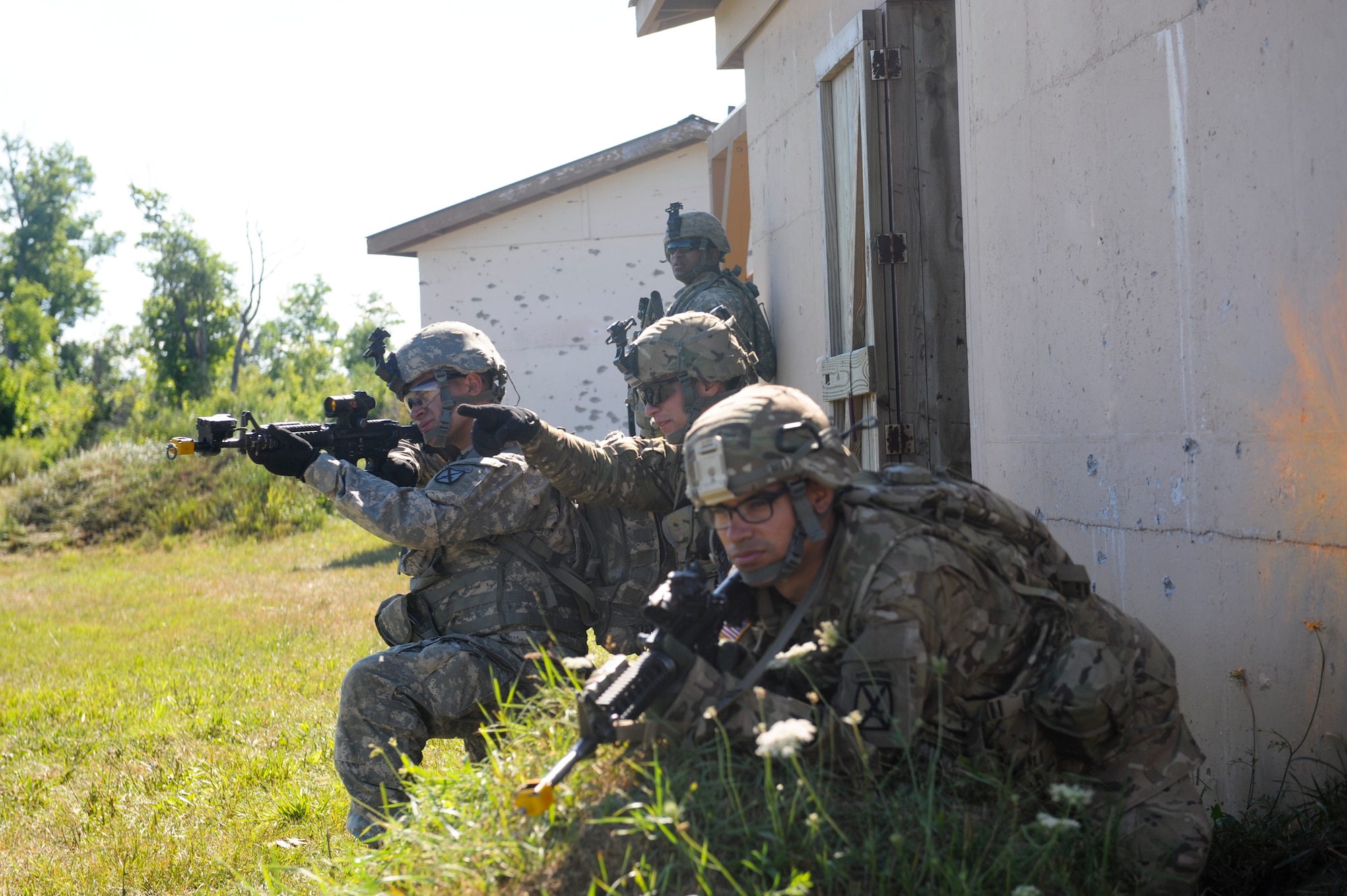 U.S. Army soldiers from the 10th Mountain Division, 4-31 Infantry Battalion, Bravo Company, 2nd Platoon, scan the surroundings during a training scenario at Fort Drum, N.Y., July 25, 2012. The soldiers ensured the area remained safe while the rest of their platoon infiltrated a village. (U.S. Air Force photo by Airman 1st Class Douglas Ellis/Released)
