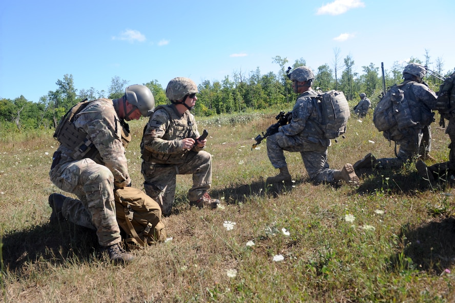U.S. Air Force Senior Airman Yorke Goddard, 20th Air Support Operations Squadron joint terminal attack controller, and Airman 1st Class Titus Baker, 20th ASOS radio operator, maintenance and driver, work with U.S. Army Soldiers during exercise Mountain Peak at Fort Drum, N.Y., July 25, 2012.  This exercise is held annually and prepared more than 10,000 service members for future deployments.  (U.S. Air Force photo by Airman 1st Class Douglas Ellis/Released)
