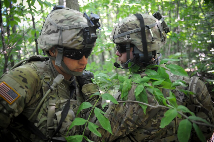 U.S. Army soldiers from the 10th Mountain Division, 4-31 Infantry Battalion, Bravo Company, 2nd Platoon, plan a strategic advancement toward an objective during a training scenario during exercise Mountain Peak at Fort Drum, N.Y., July 25, 2012. Their objective was to engage a village and capture a high value target. (U.S. Air Force photo by Airman 1st Class Douglas Ellis/Released)
