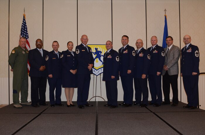 Col. Erik Hansen, 437th Airlift Wing commander (left), and Chief Master Sgt. Gerard Komen, 437th Maintenance Operations Squadron (right), congratulate the 437th Airlift Wing Second Quarter Innovator Team Award Winners after a ceremony at the Charleston Club, Aug. 2, 2012 at Joint Base Charleston, S.C. (left to right) Lawrence Strother, 437th Aircraft Maintenance Squadron; Master Sgt. Glenn Hill, 437th Maintenance Operations Squadron; Tech. Sgt. Jonica Parker, 437th Maintenance Squadron; Master Sgt. Scott Kapanke, 437th MXS; Master Sgt. Gregory Milano, 437th AMXS; Senior Master Sgt. Daniel Small, 437th AMXS; Master Sgt. Paul Holland, 437th AMXS; Master Sgt. Matthew Koeln, 437th AMXS and Mark Gardner, 437th AMXS. Not pictured are Senior Master Sgt. Jayson Johnston, 315th AMXS; Master Sgt. Adam Morgan, 437th AMXS, Master Sgt. Dennis Wells, 437th AMXS; and Senior Airman Calli Marshall, 437th AMXS. The winners were nominated for creating a process which would include better coverage of maintenance support activities, increase quality of life, even the workload for all shifts and create more reliable work schedules for maintenance workers. (U.S. Air Force photo by Staff Sgt. Katie Gieratz)