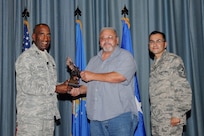 Gen. Alfred J. Stewart, Air Force Personnel Center commander, and Chief Master Sgt. Ruben Gonzales, AFPC command chief, present the Civilian Supervisory Category I of the Quarter Award to John Hernandez, 902nd Mission Support Group. The second-quarter Joint Base San Antonio-Randolph award winners were recognized during a ceremony at the base theater August 3.
(U.S. Air Force photo by Melissa Peterson)

