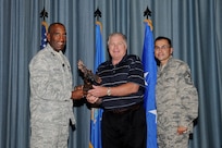 Gen. Alfred J. Stewart, Air Force Personnel Center commander, and Chief Master Sgt. Ruben Gonzales, AFPC command chief, present the Civilian Non-Supervisory Category III of the Quarter Award to Byron Cotton, Air Education and Training Command. The second-quarter Joint Base San Antonio-Randolph award winners were recognized during a ceremony at the base theater August 3.
(U.S. Air Force photo by Melissa Peterson)

