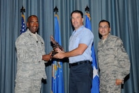 Gen. Alfred J. Stewart, Air Force Personnel Center commander, and Chief Master Sgt. Ruben Gonzales, AFPC command chief, present the Civilian Wage Grade of the Quarter Award to Darrell Tillman, 12th Flying Training Wing. The second-quarter Joint Base San Antonio-Randolph award winners were recognized during a ceremony at the base theater August 3.
(U.S. Air Force photo by Melissa Peterson)
