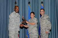 Gen. Alfred J. Stewart, Air Force Personnel Center commander, and Chief Master Sgt. Ruben Gonzales, AFPC command chief, present the Company Grade Officer of the Quarter Award to Capt. Anita Logan, Air Education and Training Command. The second-quarter Joint Base San Antonio-Randolph award winners were recognized during a ceremony at the base theater August 3.
(U.S. Air Force photo by Melissa Peterson)
