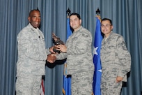 Gen. Alfred J. Stewart, Air Force Personnel Center commander, and Chief Master Sgt. Ruben Gonzales, AFPC command chief, present the Honor Guard Airman of the Quarter Award to Senior Airman Louis Diaz, 359th Medical Group. The second-quarter Joint Base San Antonio-Randolph award winners were recognized during a ceremony at the base theater August 3.
(U.S. Air Force photo by Melissa Peterson)
