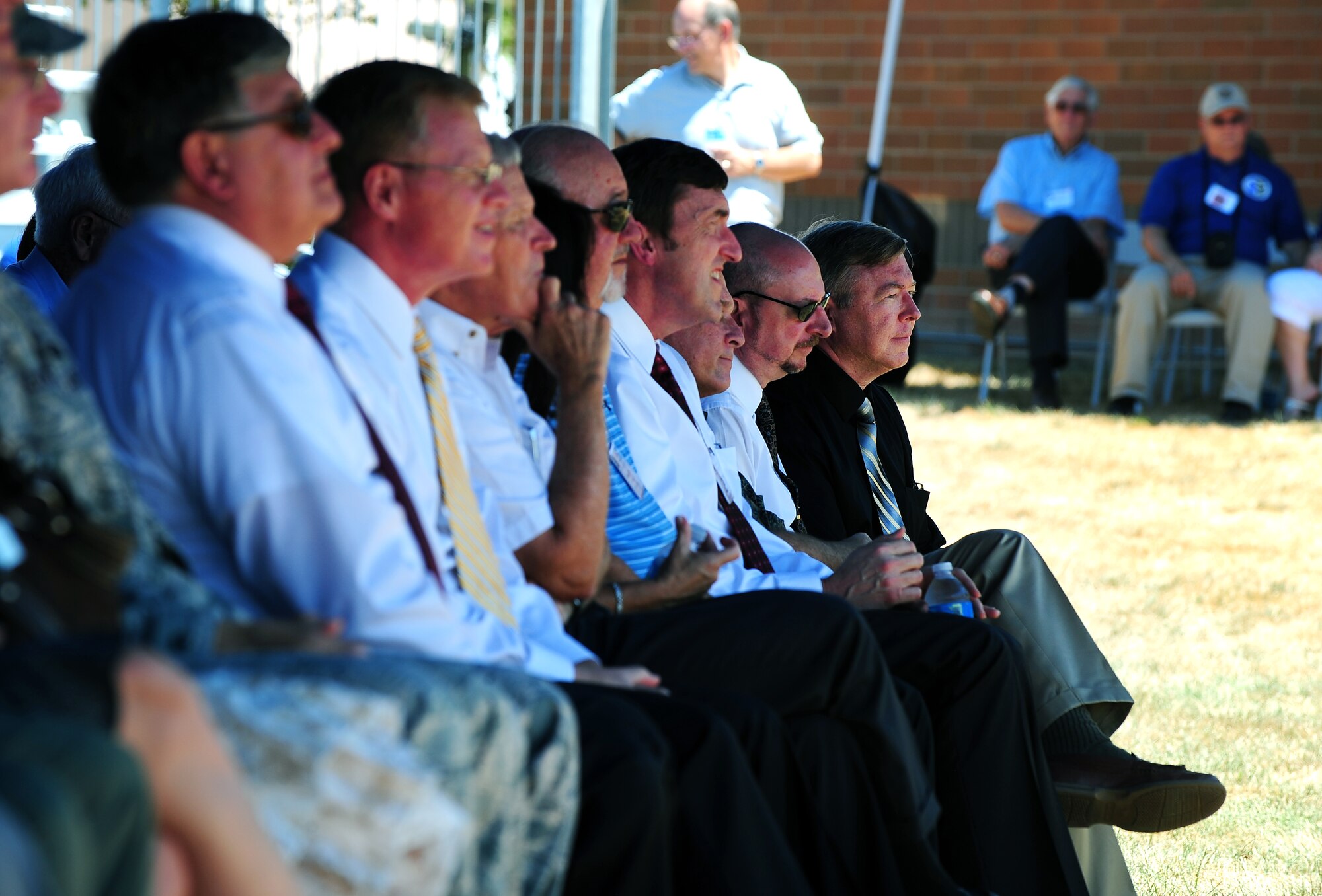Former Air Force Weather Commanders sit front row at the 75th Anniversary celebrations held at the AFWA headquarters building Offutt Air Force Base, Neb., Aug. 2.  The celebration started with a plaque unveiling along with a fallen warrior plaque and a heritage panel discussing the crucial role of the weather mission as it pertains to the war fighting capabilities of the U.S. military.  (U.S. Air Force Photo by Josh Plueger/Released)