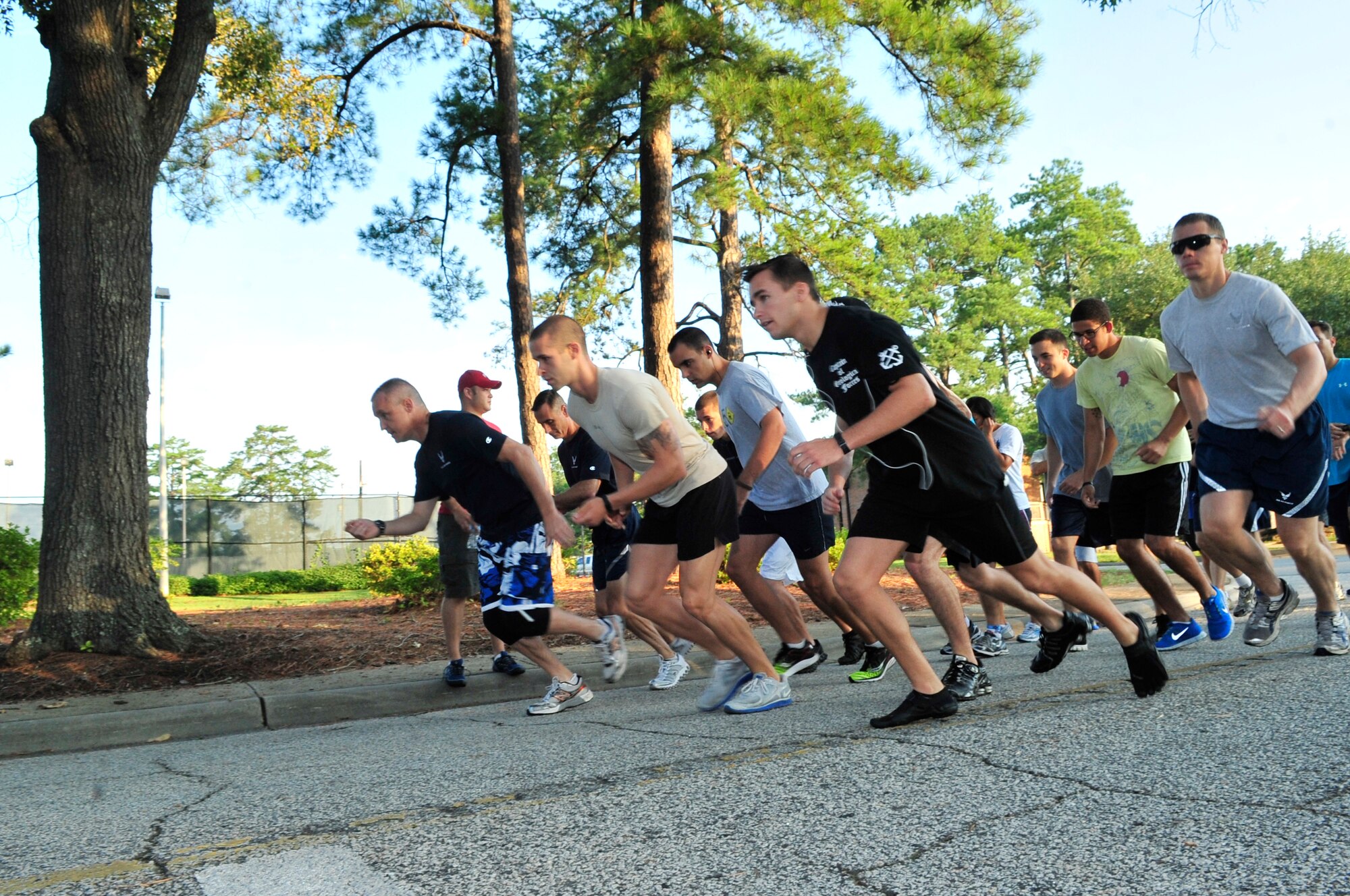 U.S. Air Force Airmen and their families begin a five-kilometer run at Memorial Lake, Shaw Air Force Base, S.C., June 3, 2012.  The run was the first event of the 9th Air Force and U.S. Air Forces Central family day.(U.S. Air Force photo by Airman Nicole Sikorski/Released) 