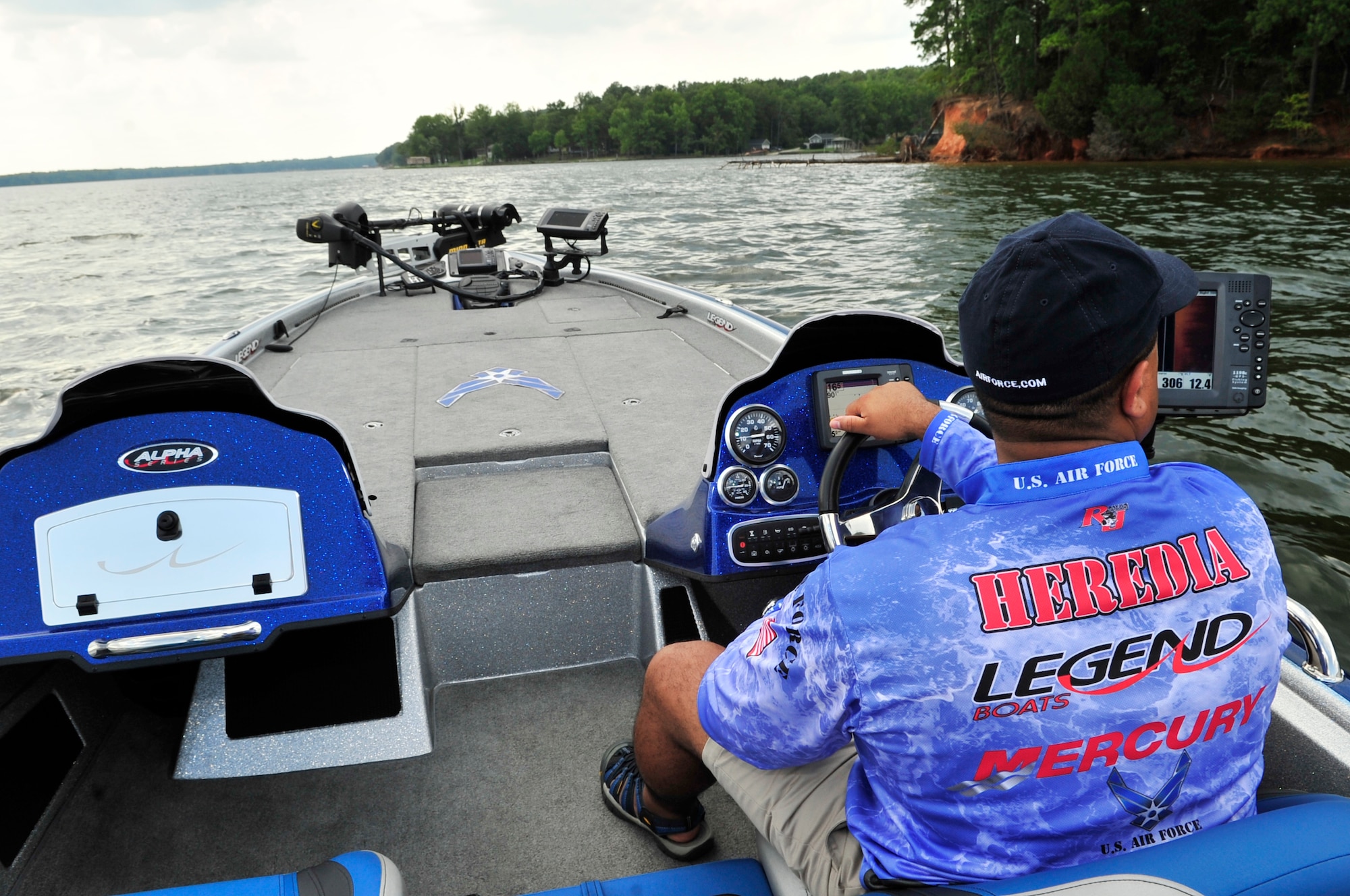 Ray Heredia, U.S. Air Forces Central and 9th Air Force video teleconference engineer, drives his Legend Air Force speed boat, Wateree Lake, S.C., Aug. 3, 2012.  Heredia has been competing in bass fishing tournaments since 1994.(U.S. Air Force photo by Airman Nicole Sikorski/Released) 