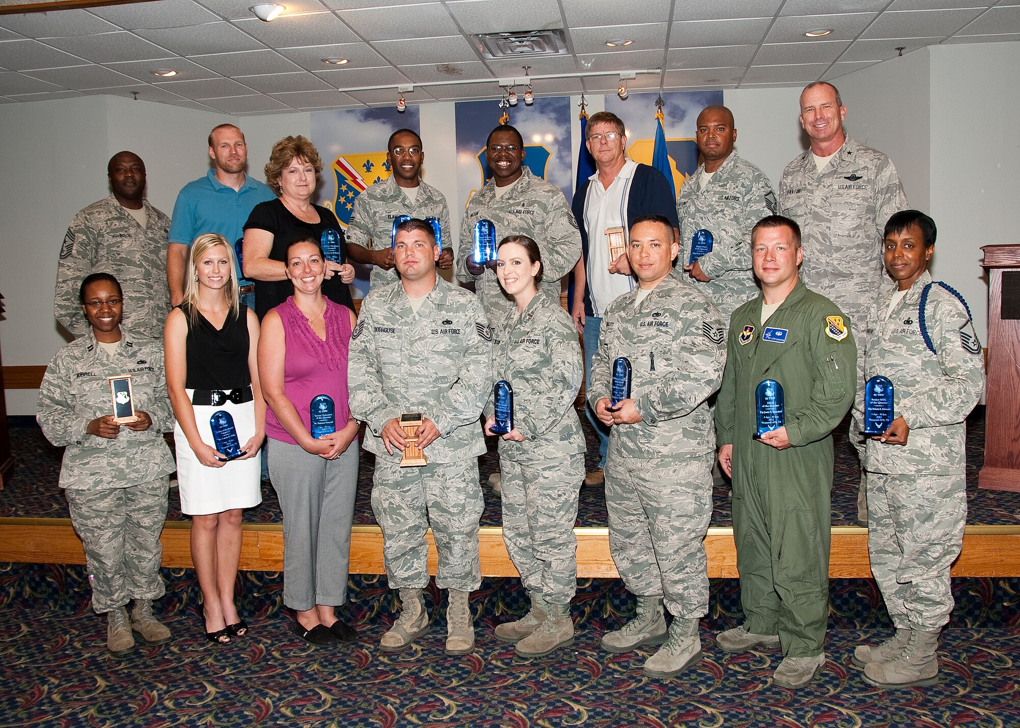 Brigadier General Michael Fantini (back row, far right), 82nd Training Wing commander, and Chief Master Sgt. Eric Johnson, 82nd Training Wing command chief (back row, far left), with 82nd TRW quarterly award winners August 3, 2012 at the Sheppard Air Force Base, Texas.  The winners were announced during a luncheon held at the base club.  (U.S. Air Force photo/Frank Carter)