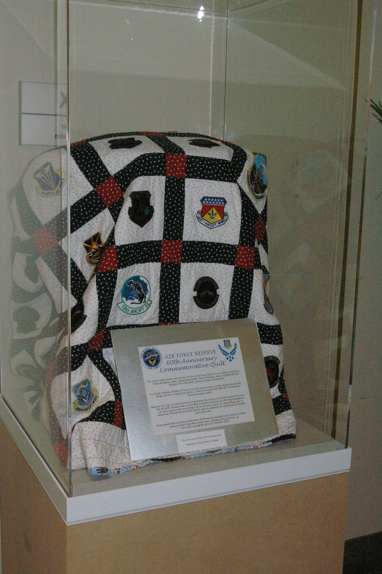 Col. Patricia Blassie, commander of the Air Reserve Personnel Center at Buckley Air Force Base, Colo., gave this one-of-a-kind Air Force Reserve Command 60th Anniversary quilt to the AFRC Heritage Hall on behalf of the center’s men and women in honor of retired Lt. Gen and Mrs. Charles E. Stenner Jr. The general is the former chief of Air Force Reserve and AFRC commander. (U.S. Air Force photo/Keith Barr)