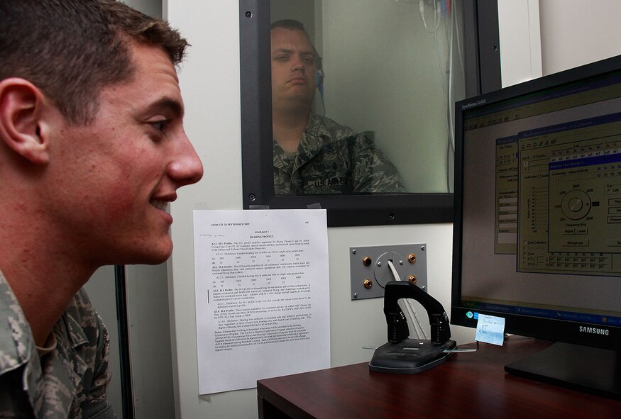 Senior Airman Scott Shay, Aeromedical Staging Squadron hearing conservation program manager, runs a routine audiogram on Tech. Sgt. Brad Kleinert, Aeromedical Staging Squadron mental health technician, to check proper running order of the machine, at the 911th Airlift Wing, July 31, 2012. The audiogram, used to check hearing loss, is mandatory for all Maintenance, Aircrew, and Combat Arms members. Personnel hear variances of decibels in order to gauge how much hearing loss, if any, has occurred while performing duty here at the 911th. (U.S. Air Force photo by Senior Airman Justyne Obeldobel/Released)