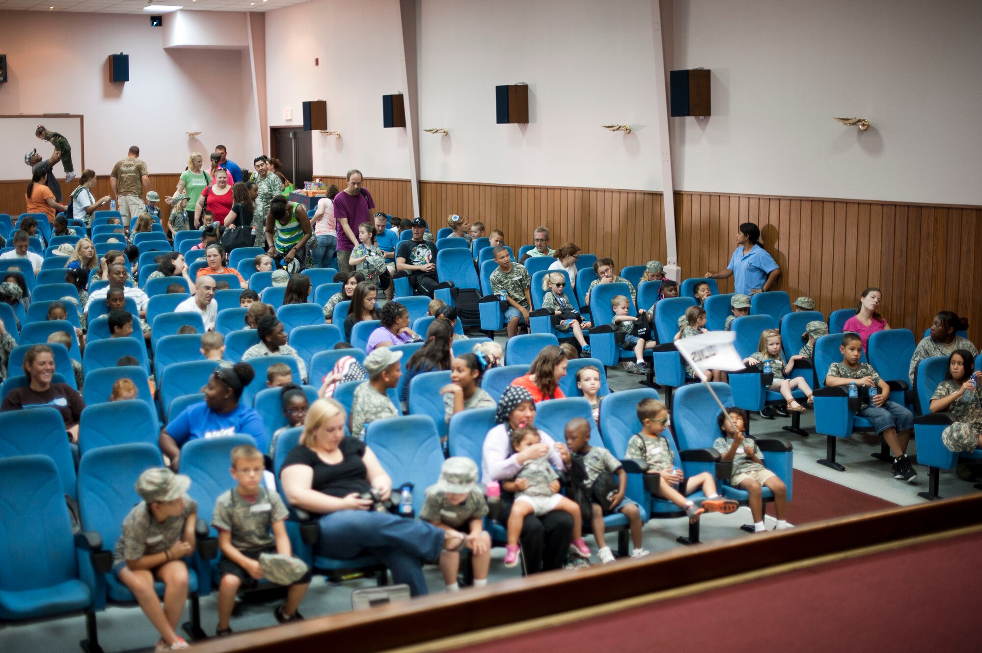 Operation Deployment participants wait for briefings Aug. 3, 2012, at Incirlik Air Base, Turkey. The event gave children and spouses of service members the opportunity to learn about the deployment process. Almost 200 people participated in the event. (U.S. Air Force photo by Senior Airman Clayton Lenhardt/Released)