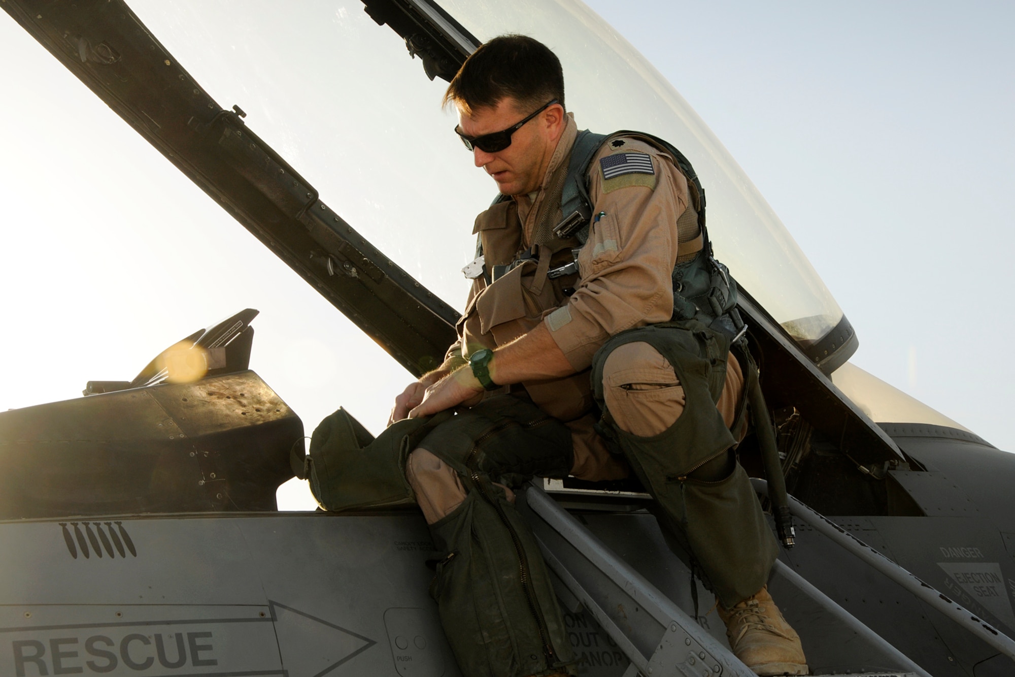 Lt. Col. Michael Rose does a preflight check on an F-16 at Kandahar Airfield, Afghanistan. (U.S. Air Force photo/Tech. Sgt. Stephen Hudson) 

