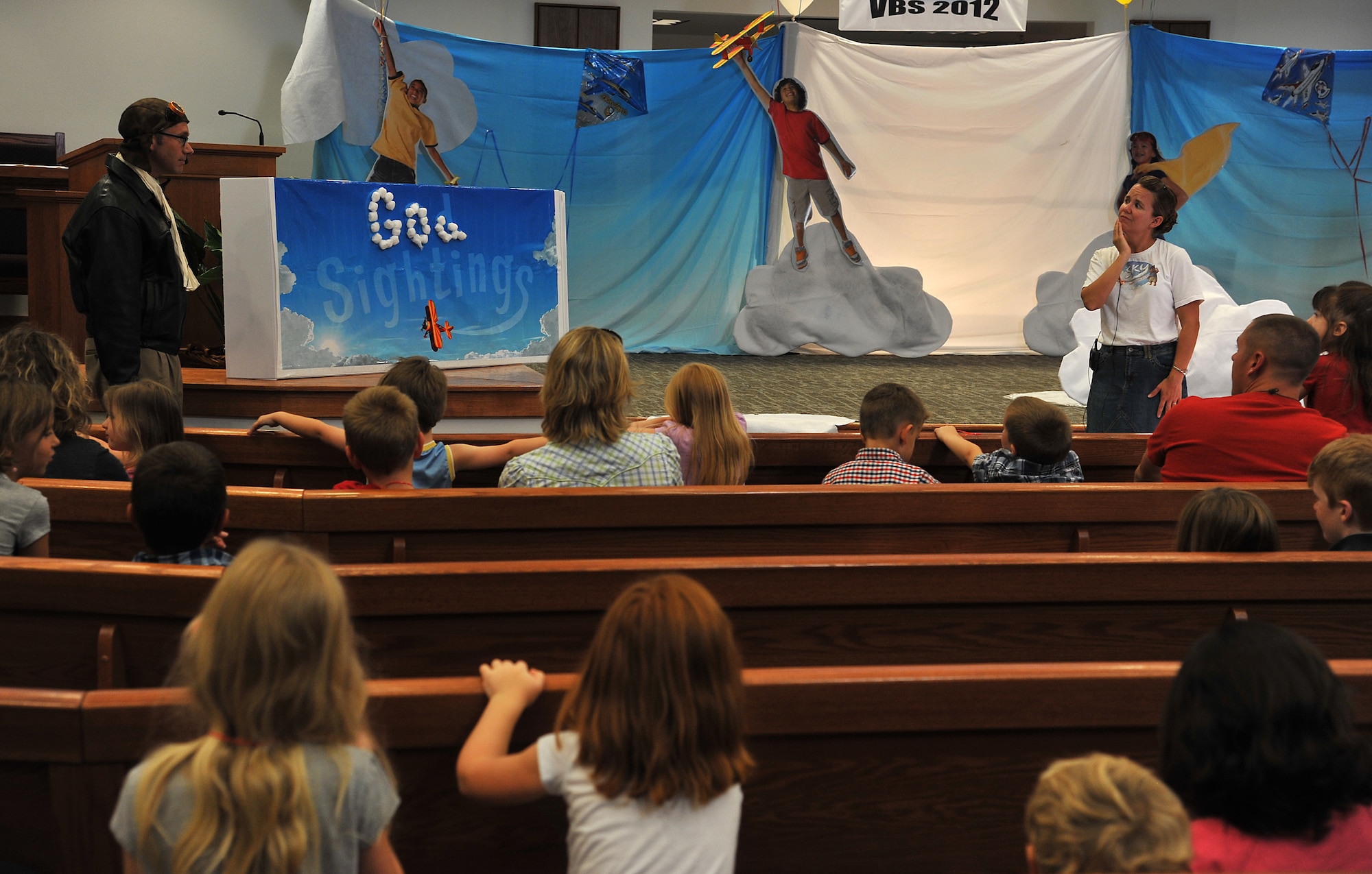 GOODFELLOW AIR FORCE BASE, Texas-- Capt. Samuel McClellan, 17th Training Wing Chapel, acts out a skit for vacation bible school with Bonnie Averett in the Taylor Chapel Aug. 3. The children raised money for mosquito nets to protect less fortunate kids from malaria. (U.S. Air Force photo/Airman 1st Class Michael Smith) 