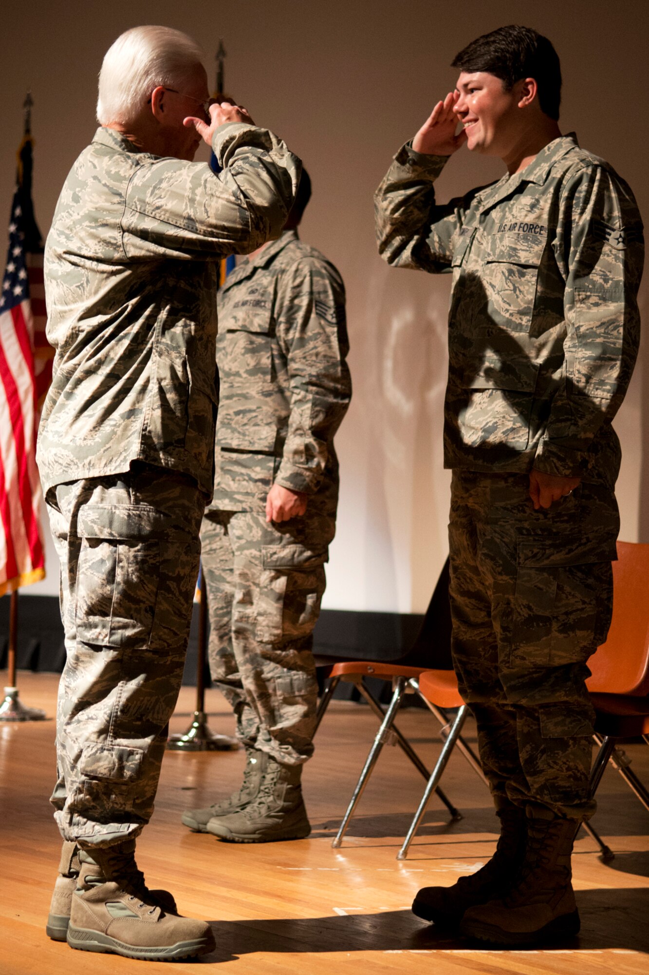 U.S. Air Force Lt. Col. Allen Smith salutes his son, Senior Airman Eric Smith, during a retirement ceremony on Barksdale Air Force Base, La., Aug. 5, 2012. Col. Smith is assigned to the 307th Medical Squadron and is retiring after serving 35 years in military. (U.S. Air Force photo by Master Sgt. Greg Steele/Released)