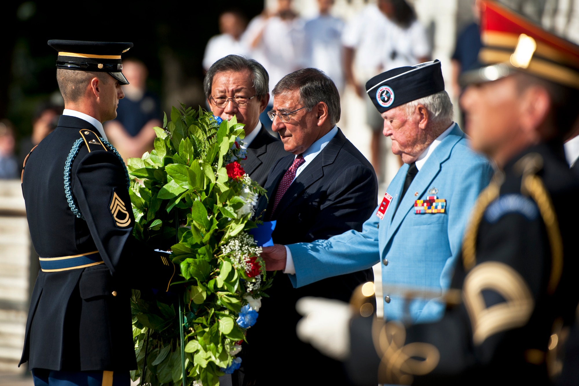 A member of the honor guard brings a wreath to Defense Secretary Leon E. Panetta as South Korean Ambassador Choi-Young jin looks on during a ceremony to mark the 59th anniversary of the signing of the Korean War armistice at Arlington National Cemetery in Arlington, Va., July 27, 2012. DOD photo by Erin A. Kirk-Cuomo  