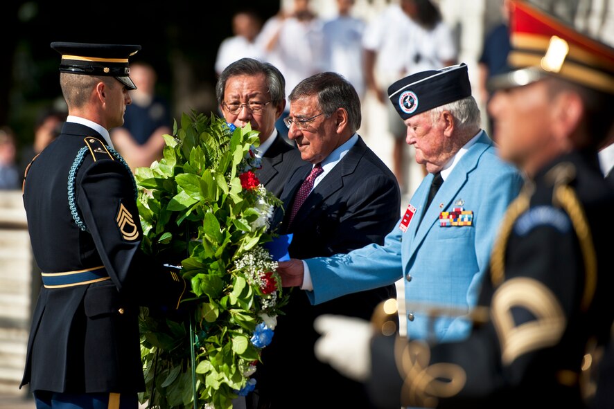 A member of the honor guard brings a wreath to Defense Secretary Leon E. Panetta as South Korean Ambassador Choi-Young jin looks on during a ceremony to mark the 59th anniversary of the signing of the Korean War armistice at Arlington National Cemetery in Arlington, Va., July 27, 2012. DOD photo by Erin A. Kirk-Cuomo  