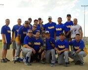 Members of the 69th Reconnaissance Group celebrate winning the intramural softball championship, Aug. 1, 2012, on Grand Forks Air Force Base, N.D.  The 69th RG defeated the 319th Logistics Readiness Squadron 18-11.  (U.S. Air Force photo by Airman 1st Class Xavier Navarro)