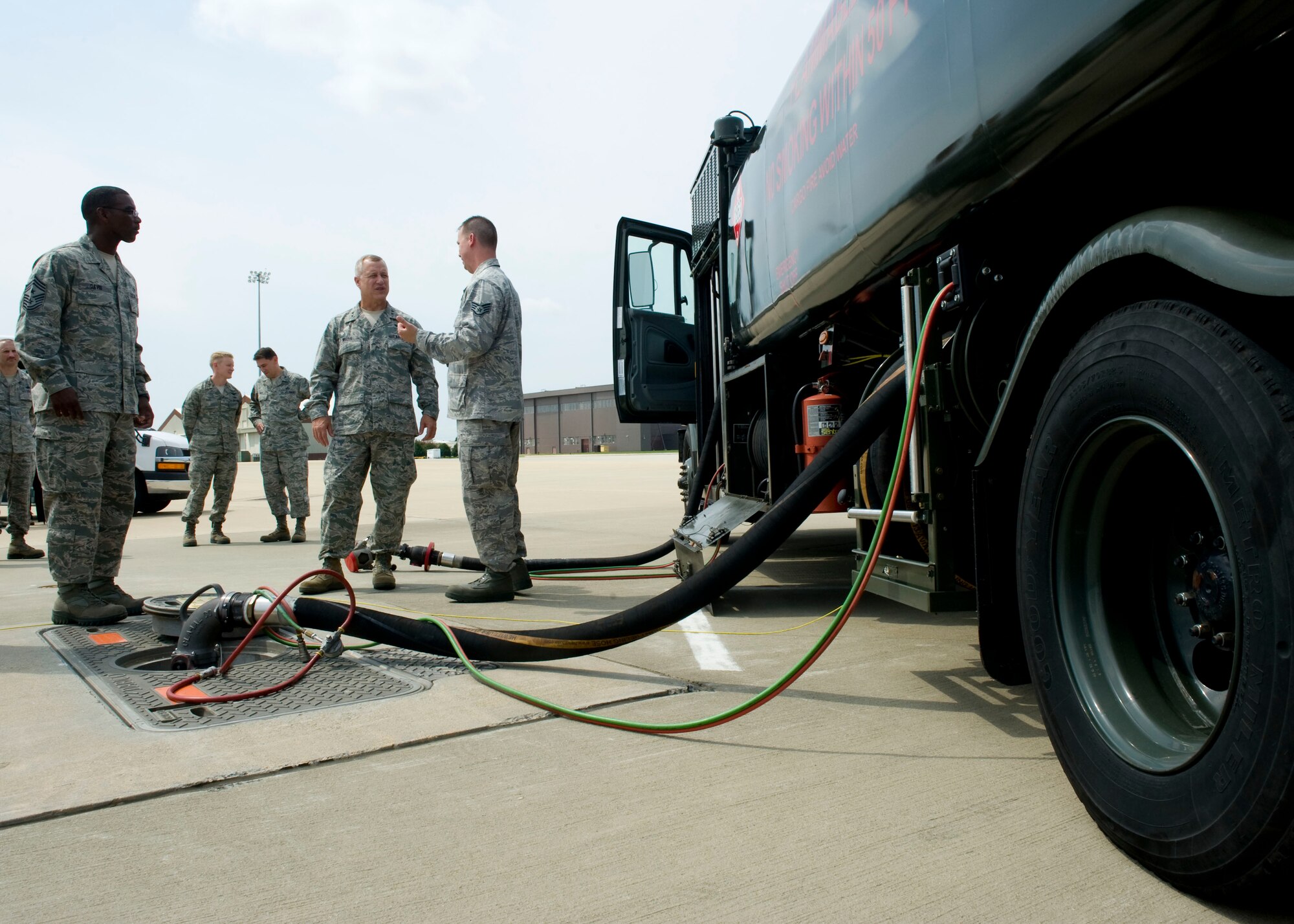 Maj. Gen. Lawrence Wells (second from right) 9th Air Force commander, and Chief Master Sgt. James Davis (left) 9th Air Force command chief, learn about a hydrant mobile refueler, August 1, 2012, at Langley Air Force Base, Va. The general toured several Joint Base Langley-Eustis units and attended a military leadership review during his visit. (U.S. Air Force photo by Senior Airman John Strong/Released)