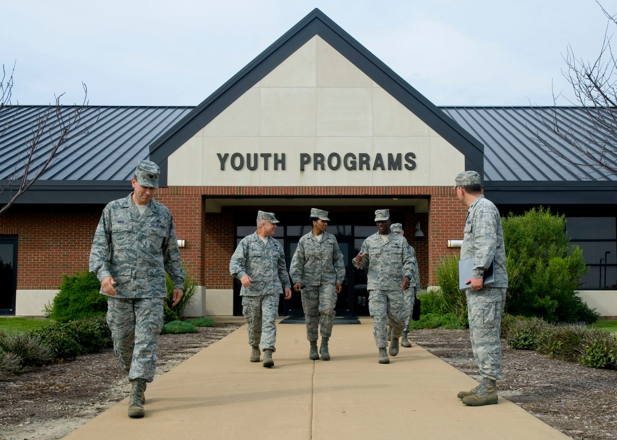Maj. Gen. Lawrence Wells, (second from left) 9th Air Force commander, converses with Chief Master Sgts. Trae King (center) 633 Air Base Wing command chief, and James Davis (second from right) 9th Air Force command chief, about the Youth Programs building plans, August 1, 2012, at Langley Air Force Base, Va. Wells visited several units around Joint Base Langley-Eustis to evaluate the standard of living for Airmen and Soldiers. (U.S. Air Force photo by Senior Airman John Strong/Released)