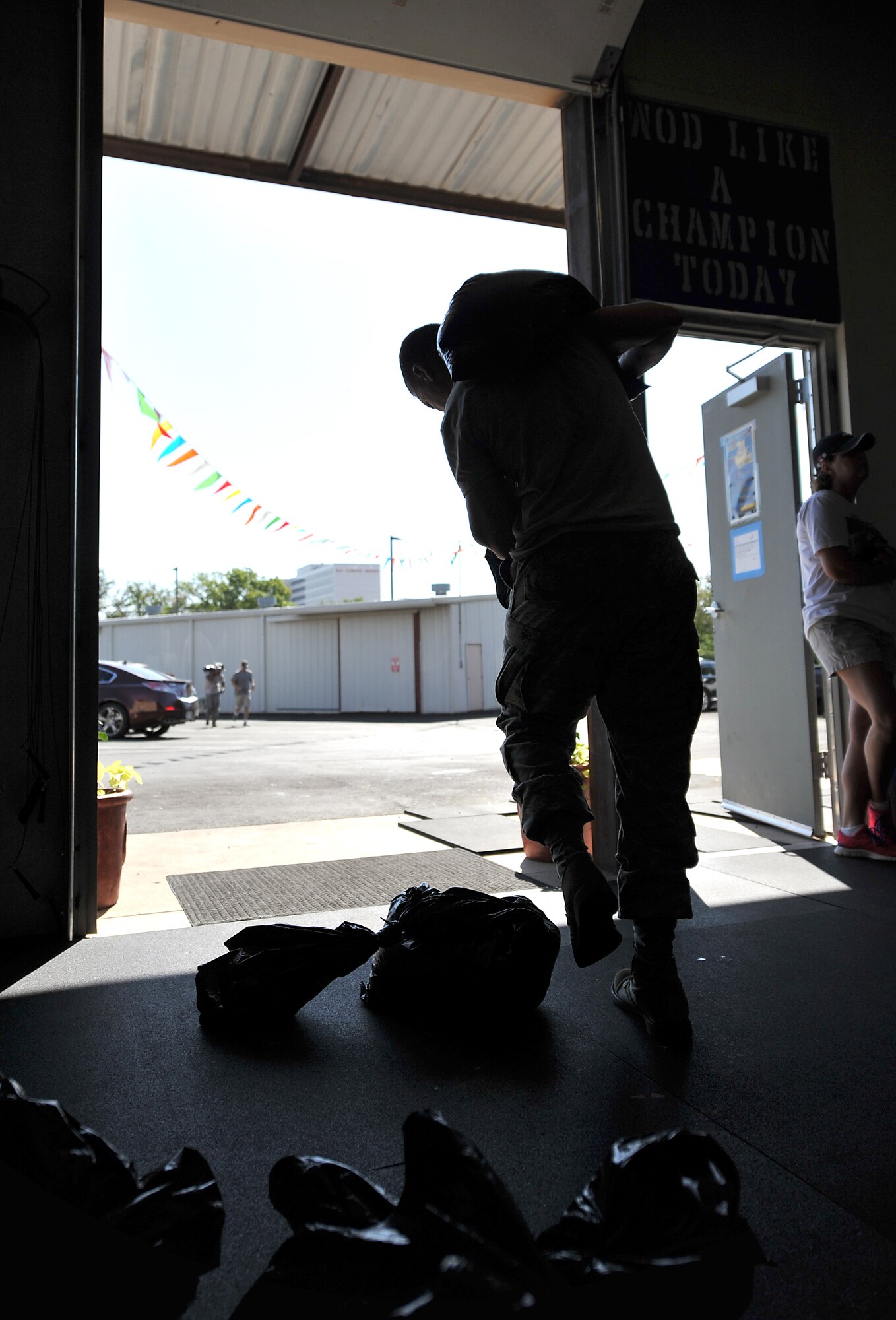 SAN ANGELO, Texas-- Staff Sgt. William Barth, 316th Training Squadron student, begins his 400 meter run with a sandbag during his workout while participating in the 31 Heroes Project at San Angelo CrossFit Aug. 4. San Angelo CrossFit raised close to $2,500 for the 31 Heroes Project, which exist to honor fallen heroes killed in action on August 6, 2011.Raising awareness through fitness, the projects aims to garner funds for programs that provide support to families of all fallen military heroes. (U.S. Air Force photo/Airman 1st Class Michael Smith) 
