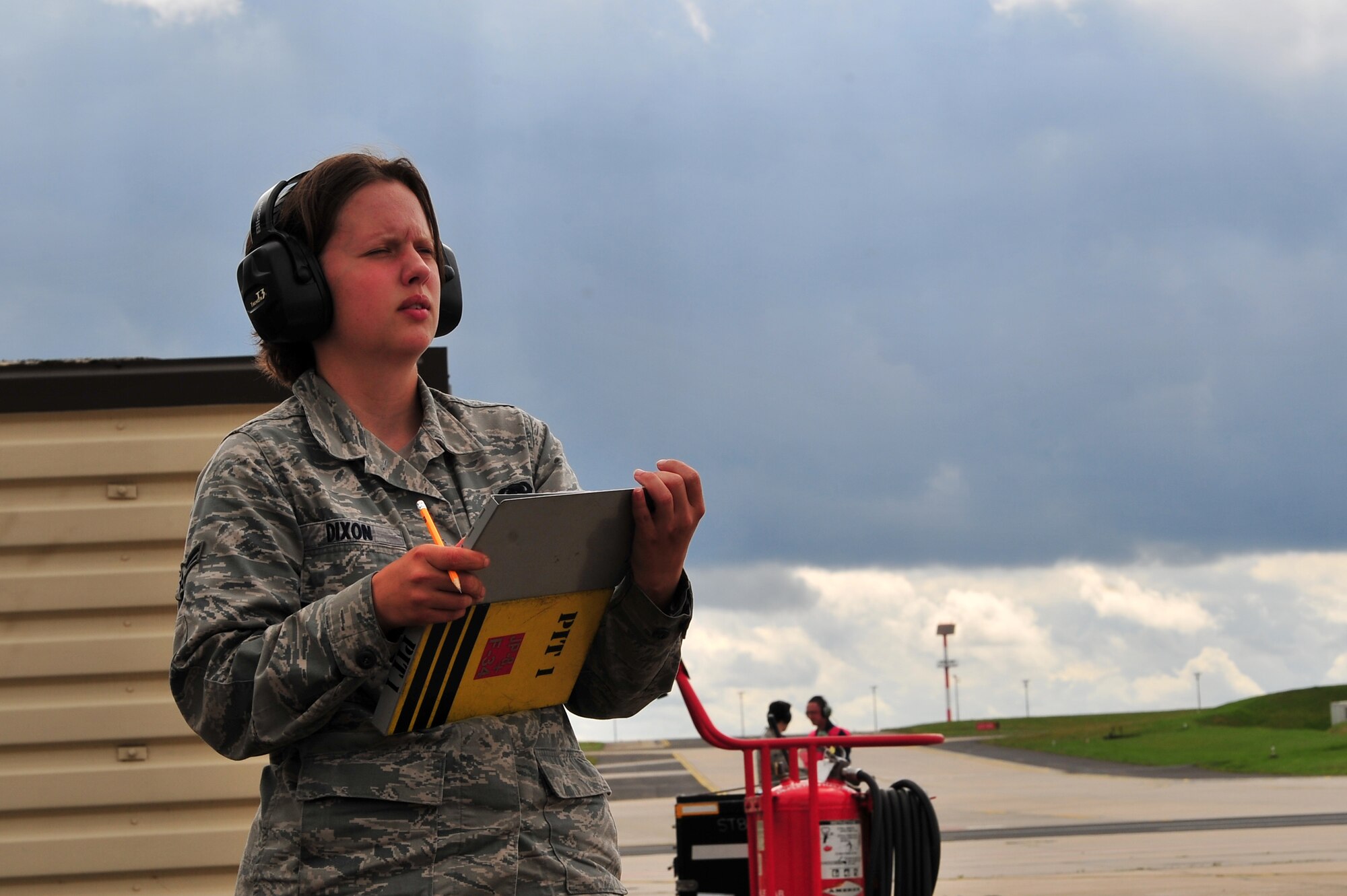 SPANGDAHLEM AIR BASE, Germany – Airman 1st Class Heather Dixon, 52nd Logistics Readiness Squadron fuels distribution operator, records aircraft information and takes accountability of fuel leaving the pump during a hot pit refueling on Ramp 3 here Aug. 6. A hot pit is the refueling of a jet while the aircraft is still running so pilots can take off right away. The fuels distribution shop quality tests aircraft fuel, conducts hot pit operations and takes accountability for all aircraft fuel. (U.S. Air Force photo by Airman 1st Class Dillon Davis/Released)
