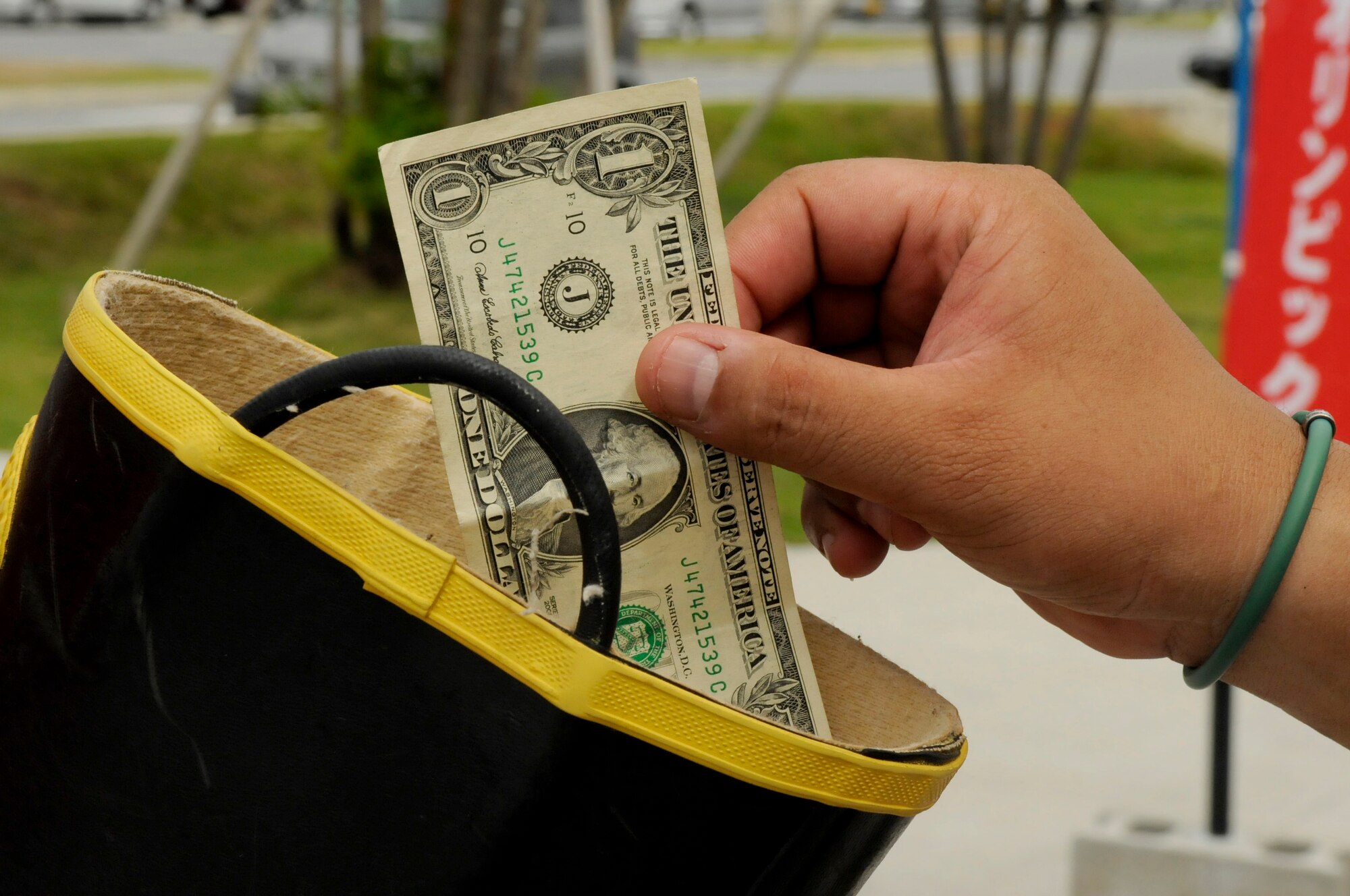 People of all ages donate to the Fill-the-Boot campaign to help raise money for the Kadena Special Olympics on Kadena Air Base, Japan, Aug. 3, 2012. A total of $27,120 was raised throughout the week to help support the 2012 KSO. (U.S. Air Force photo/Airman Tara A. Williamson)