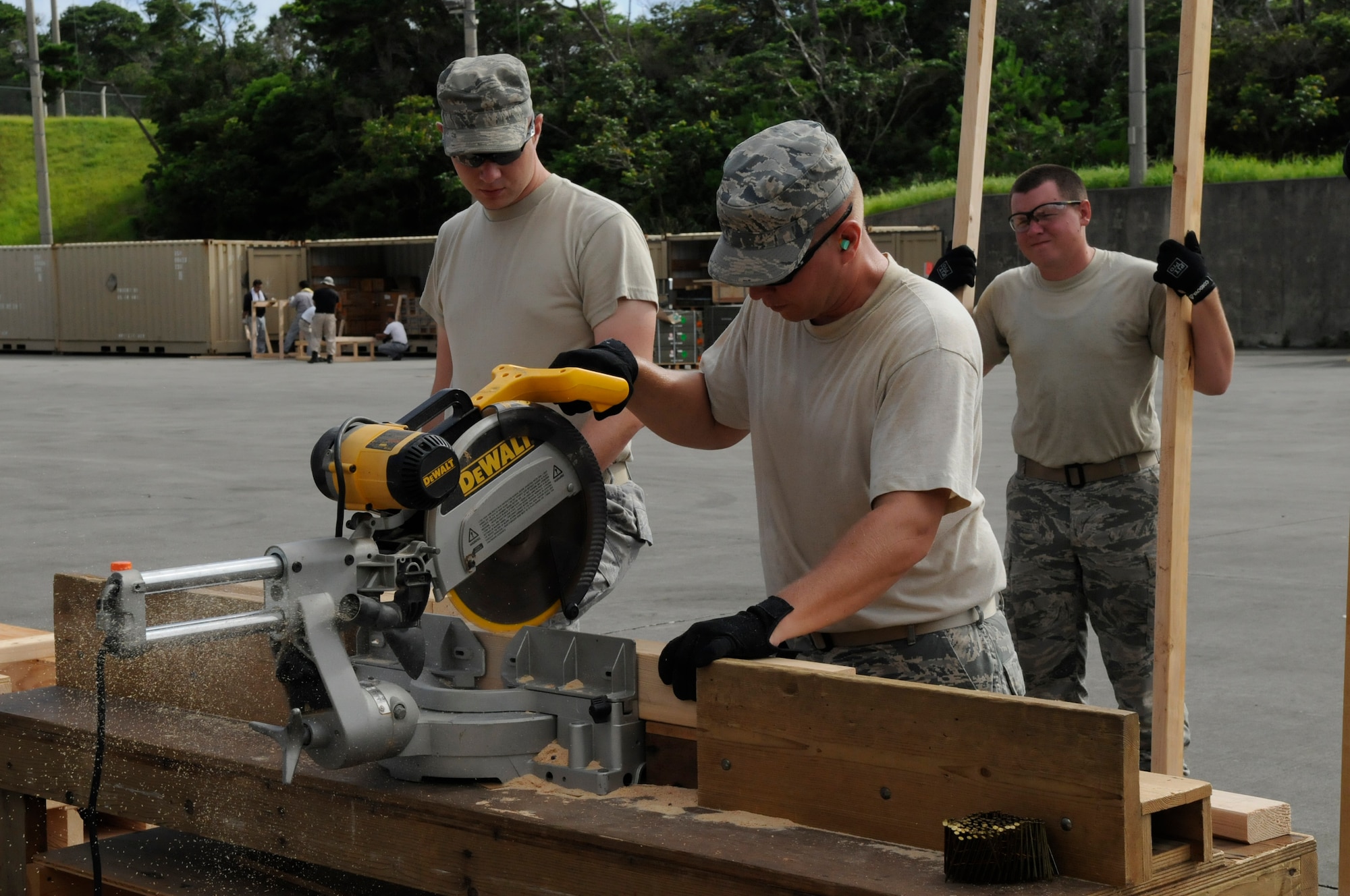 U.S. Air Force Staff Sgt. James Balchus, 18th Munitions Squadron Tactical Air Rapid Response Package member, cuts wood that will help support pallets of munitions to ensure they don't shift in transport on Kadena Air Base, Japan, July 31, 2012. The munitions will be shipped throughout the Pacific Air Forces to support the Air Force mission. (U.S. Air Force photo/Airman Tara A. Williamson)