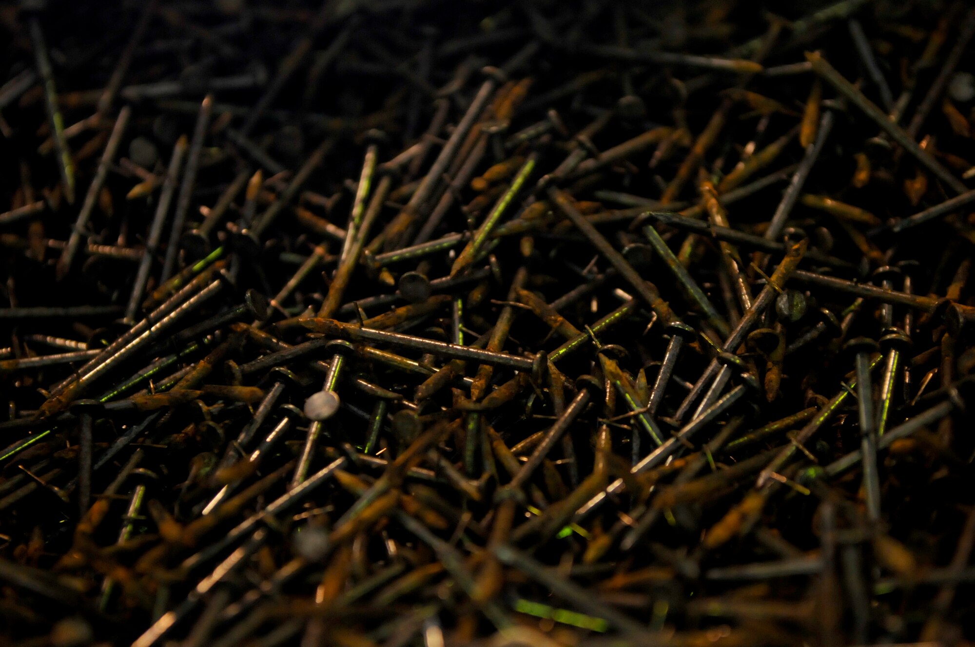 Nails lay waiting to be used to support stabilizing structures created by the Tactical Air Rapid Response Package shop of the 18th Munitions Squadron on Kadena Air Base, Japan, July 31, 2012. Approximately 40 members of TARRP use the nails to ensure the movement of the munitions being shipped throughout the Pacific Air Forces is minimal. (U.S. Air Force photo/Airman Tara A. Williamson)