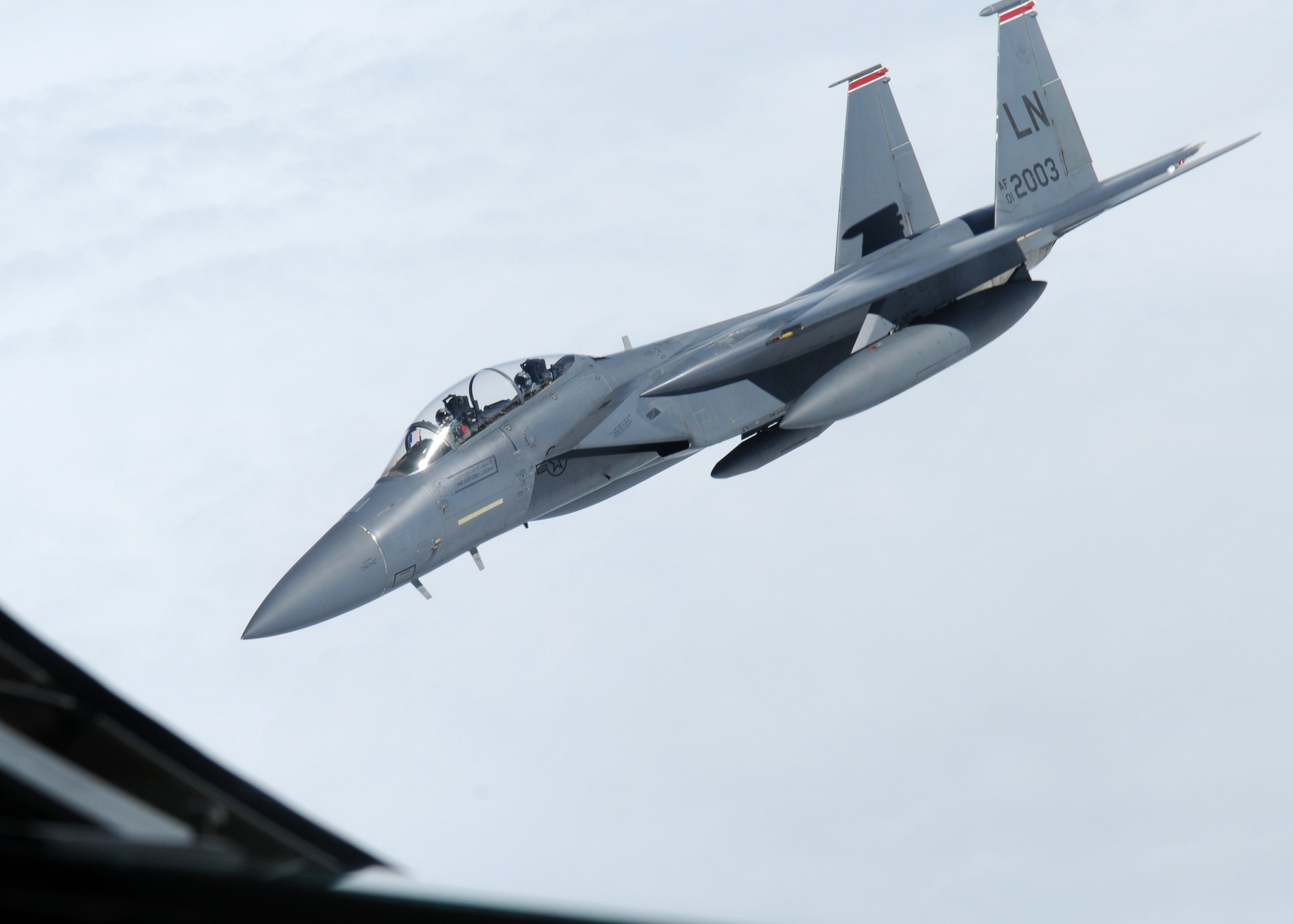 ALANTIC OCEAN – An F-15E Strike Eagle flies away from a 100th Air Refueling Wing KC-135 Stratotanker after receiving fuel Aug. 2, 2012, over the Atlantic Ocean. This particular mission was unique because the aircraft commander of the KC-135 and the weapons system officer in the F-15 are brothers and this is the first time the brothers have flown together. (U.S. Air Force photo/Senior Airman Rachel Waller)
